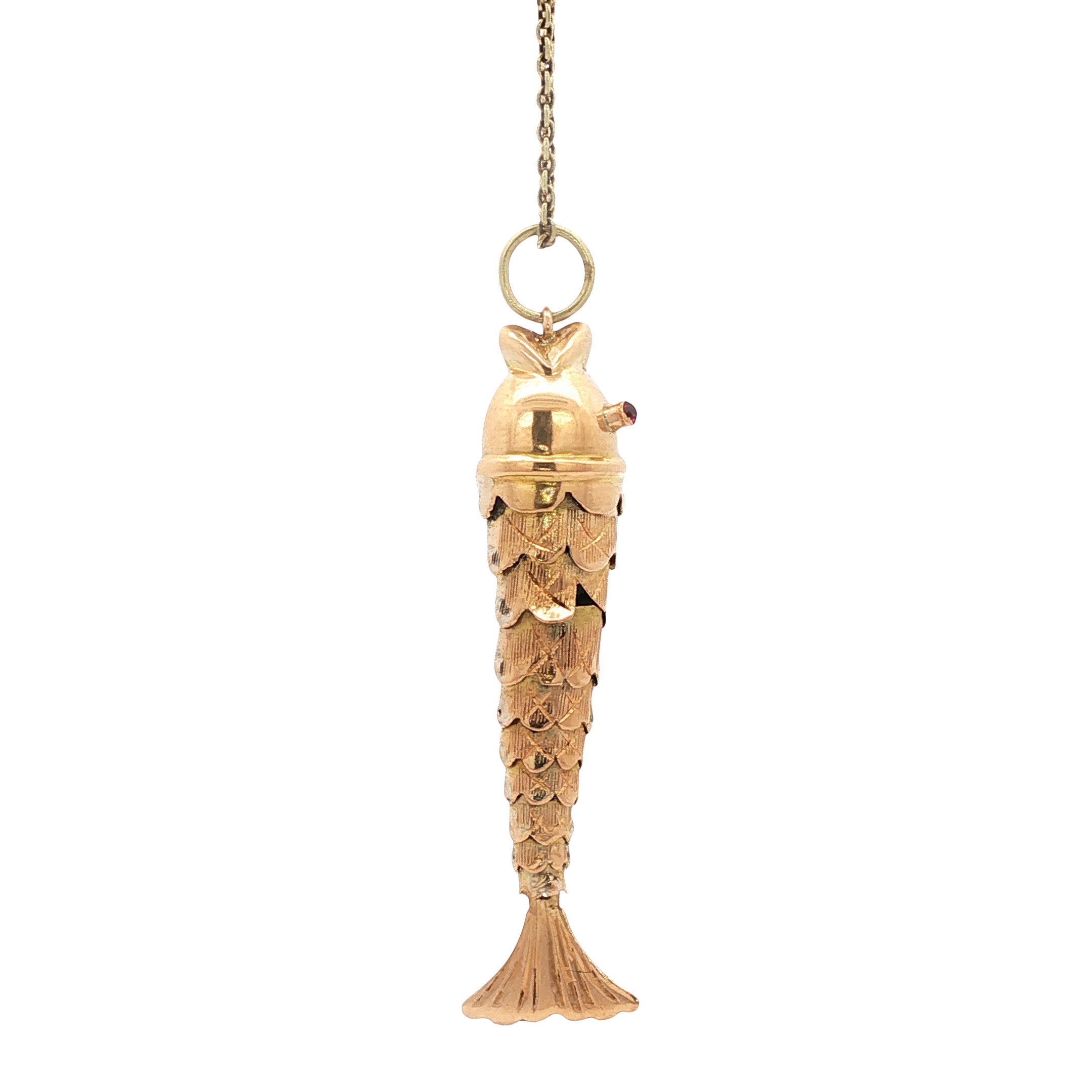 Gold fish pendant with ruby 14 kt