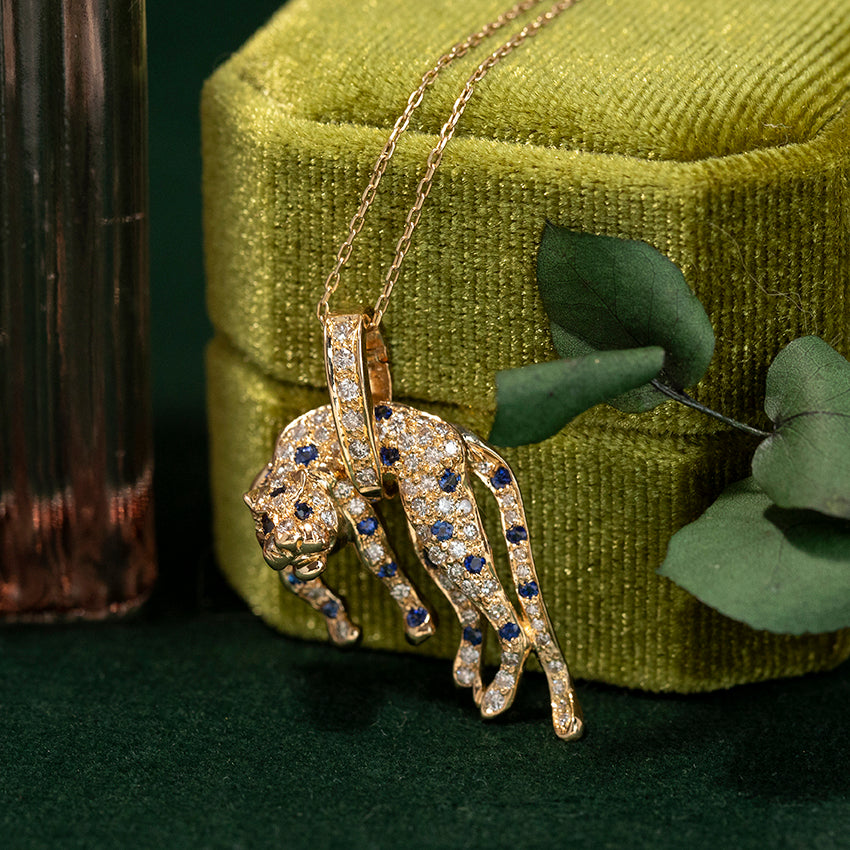 Gouden panter hanger met saffier en diamant 18 kt