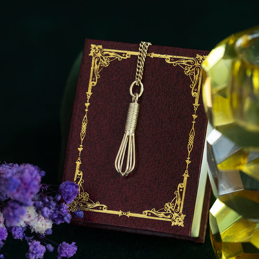 14 kt gold whisk pendant