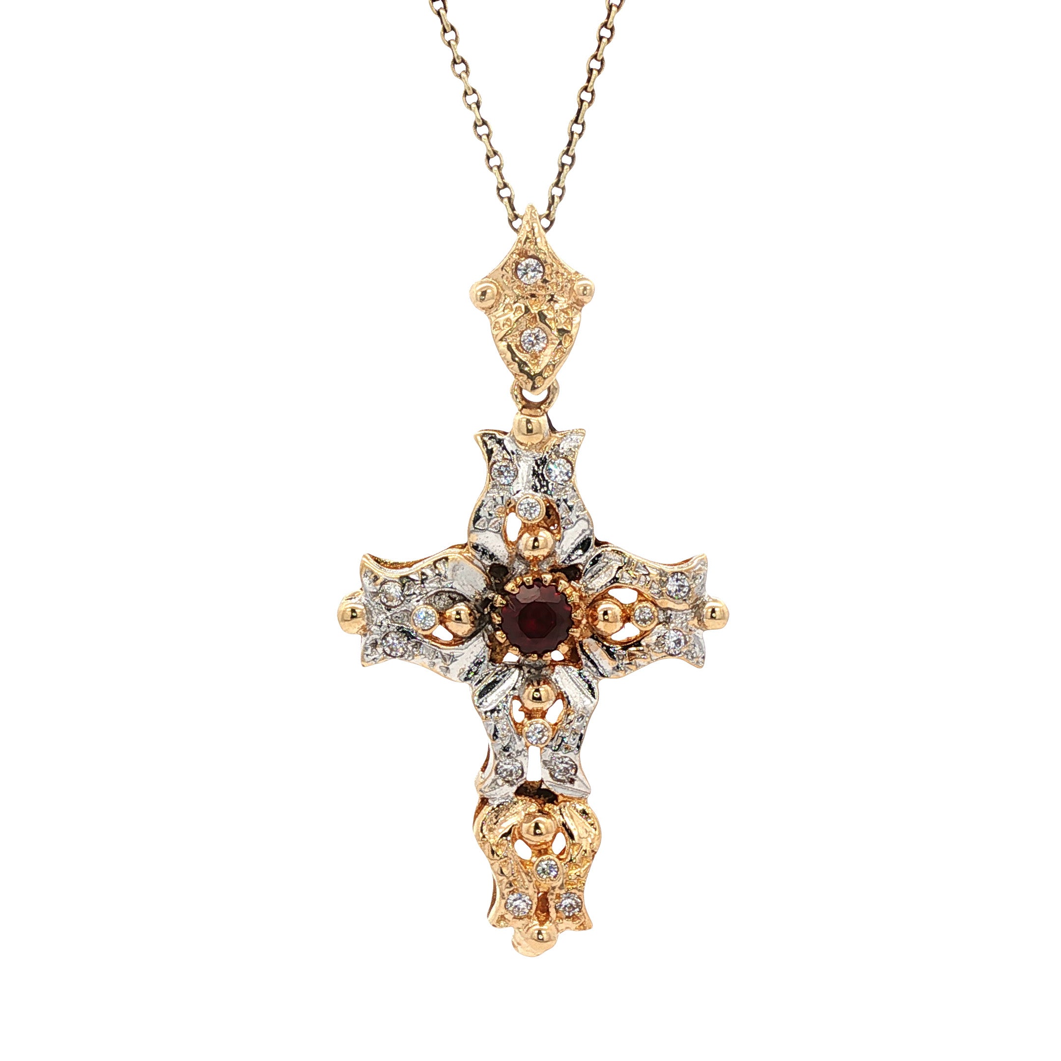 12 kt two-tone cross pendant with ruby and zirconia