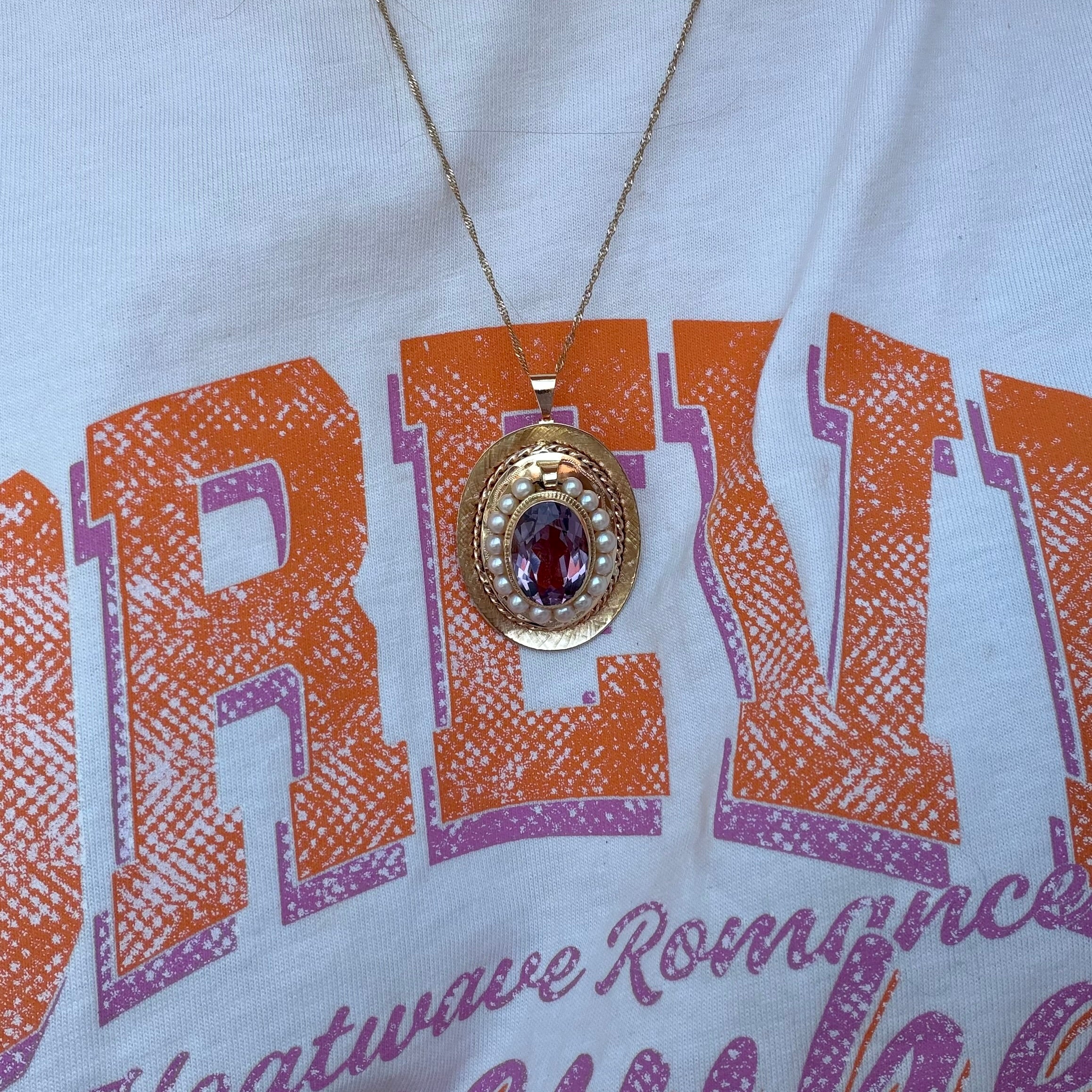 Gouden vintage hanger met parel en amethist 14 kt