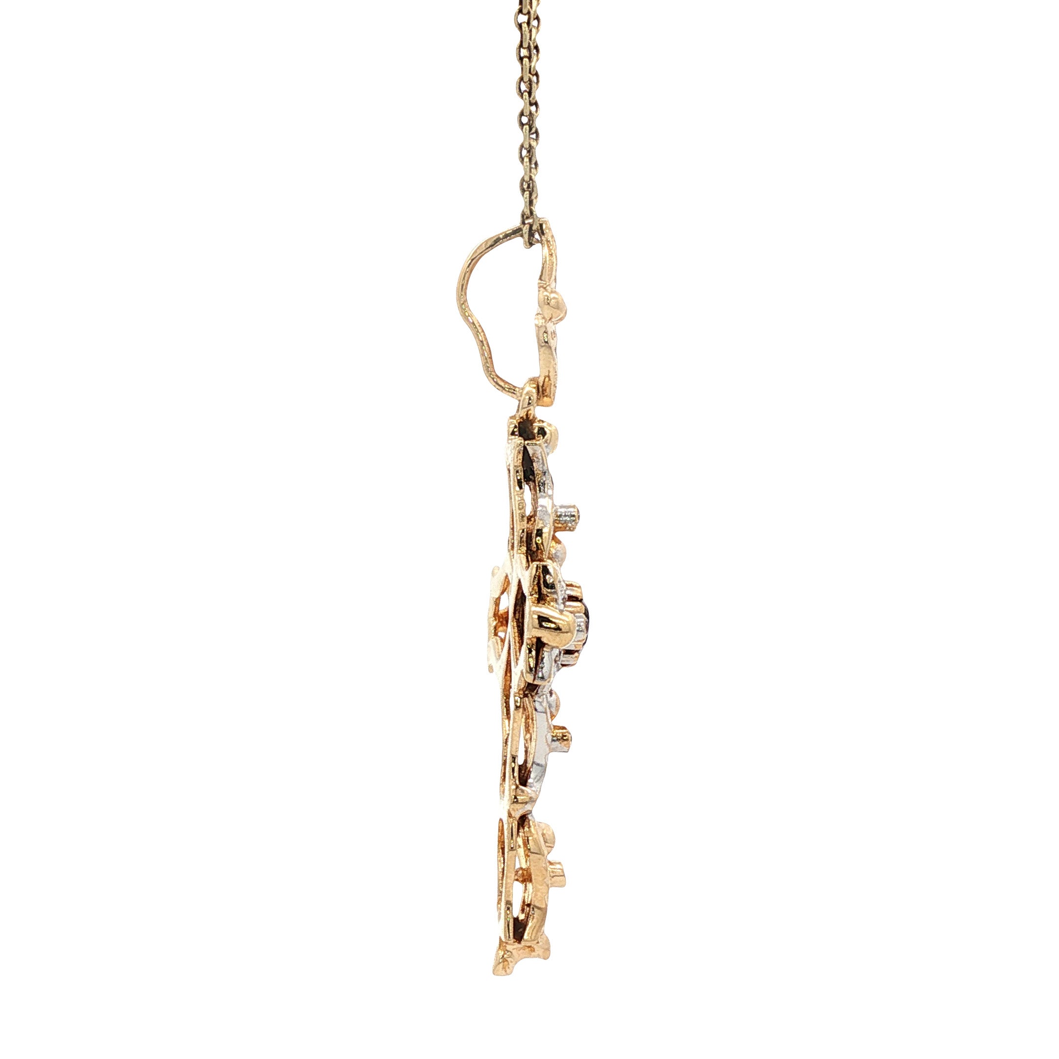 12 kt two-tone cross pendant with ruby and zirconia