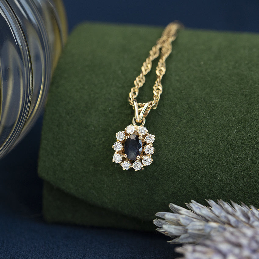 Vintage gold entourage pendant with sapphire and diamond, 14 kt