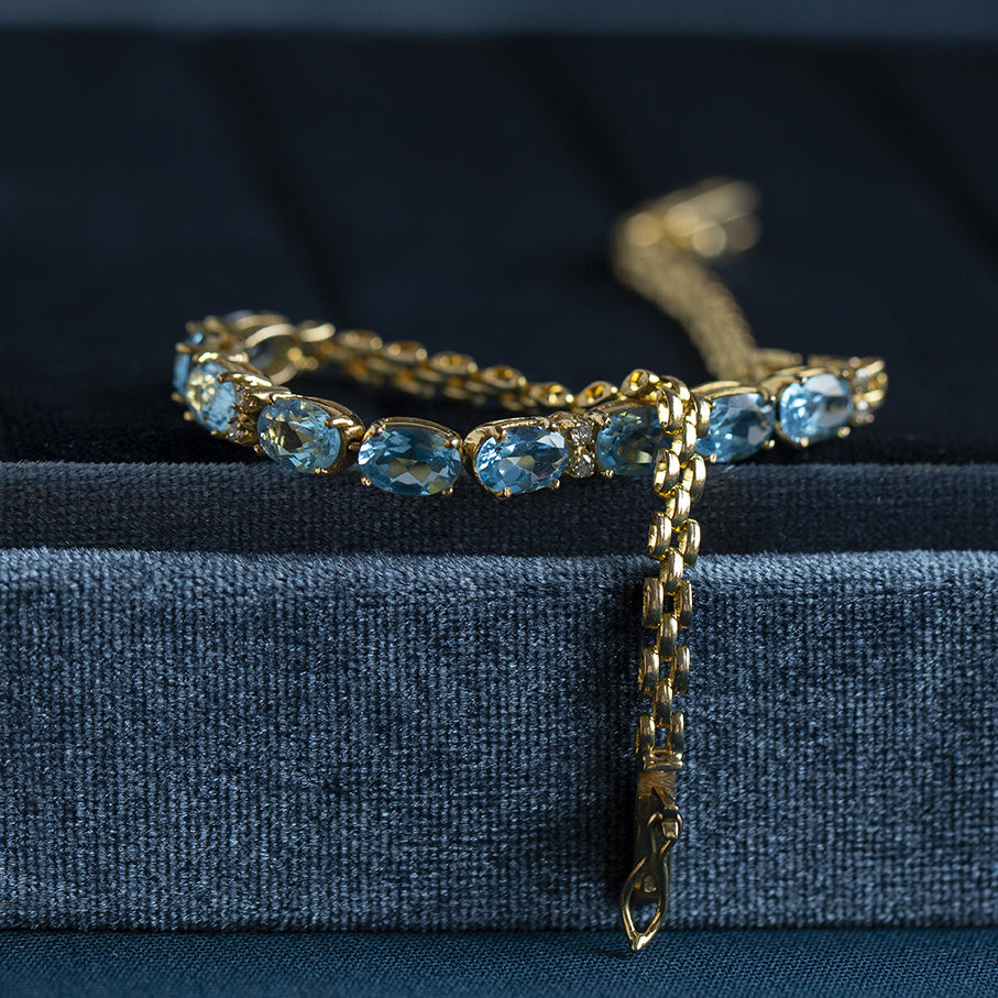 Gouden armband met topaas en diamant 18 krt