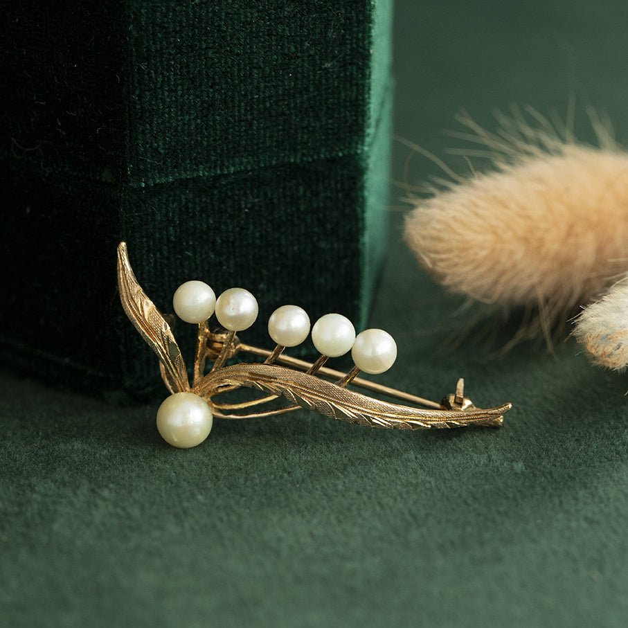 Gouden vintage broche met parel 14 krt