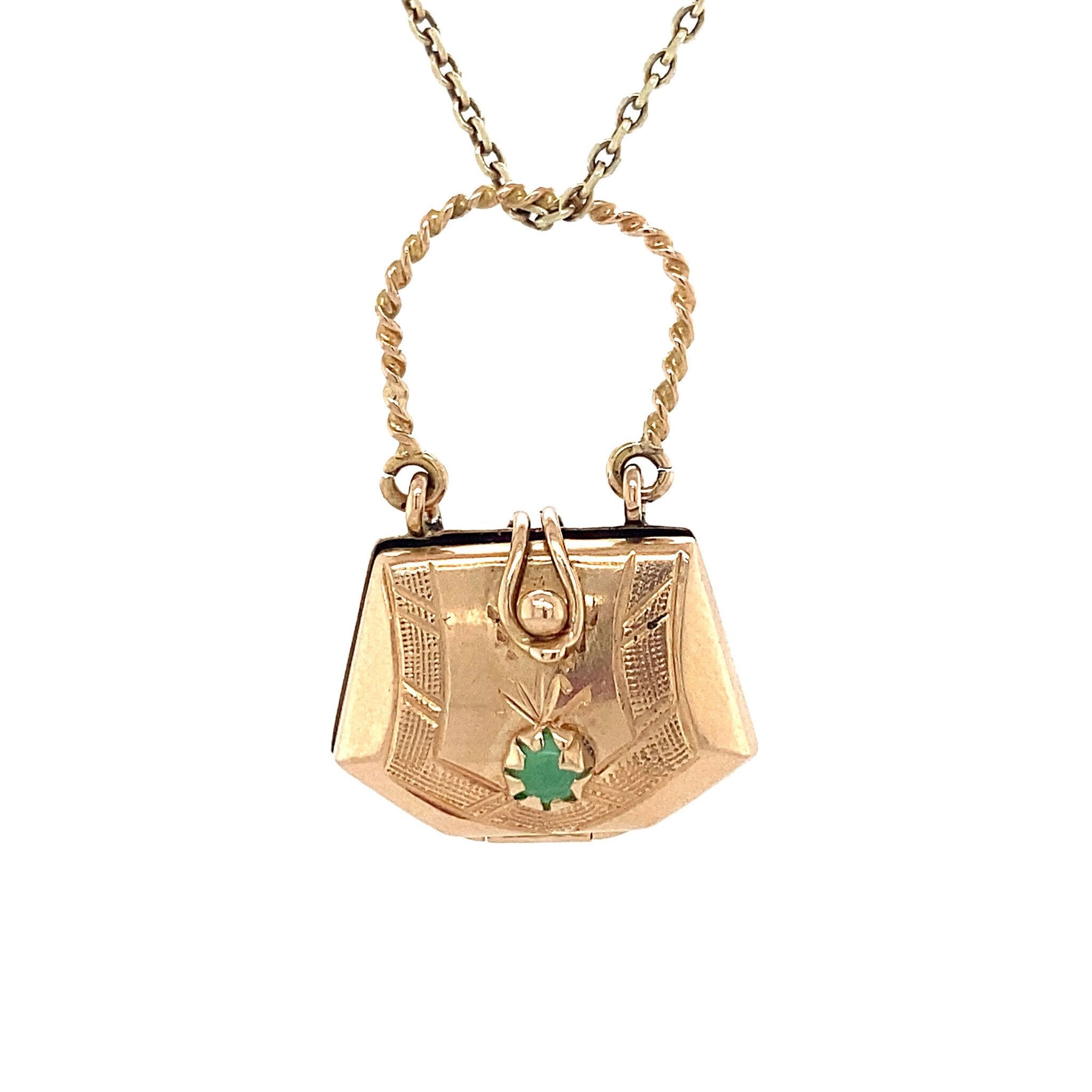 14 kt gold bag pendant with a small glass stone