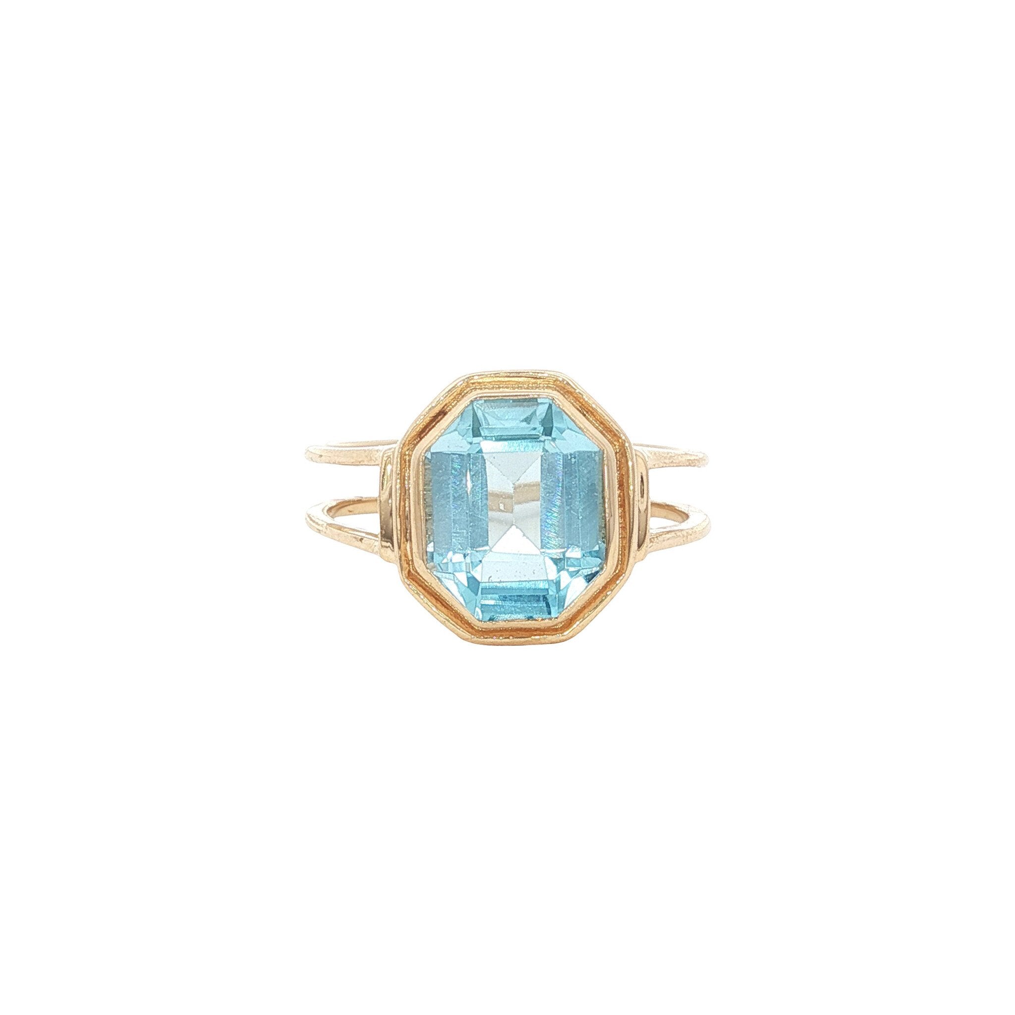 Gouden ring met blauwe topaas 14 kt