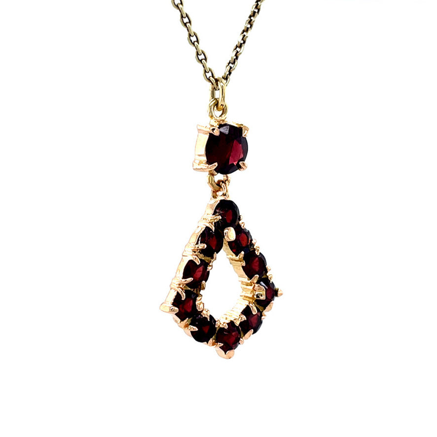 Golden vintage pendant with garnet 18 kt