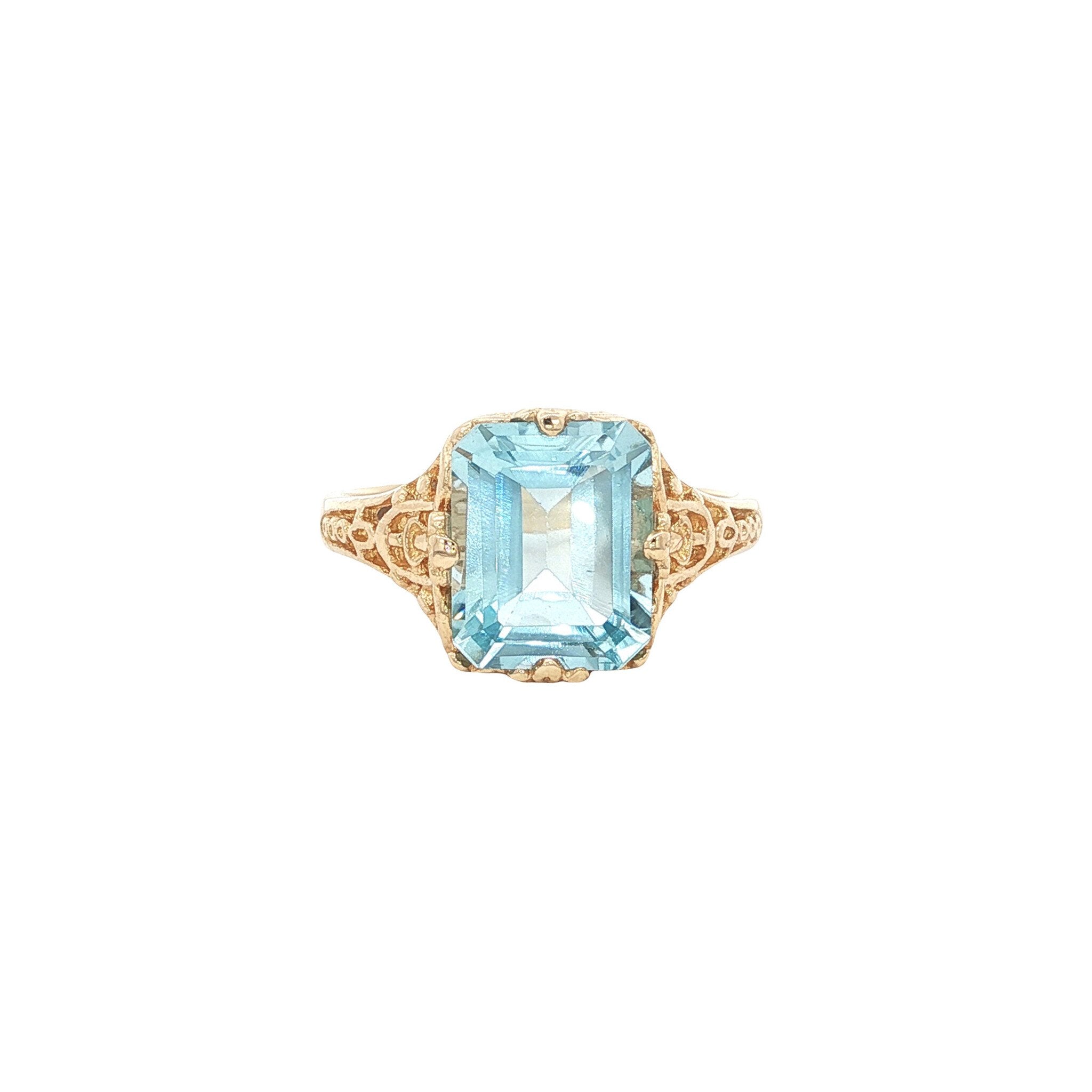 Gouden ring met blauwe topaas 14 kt