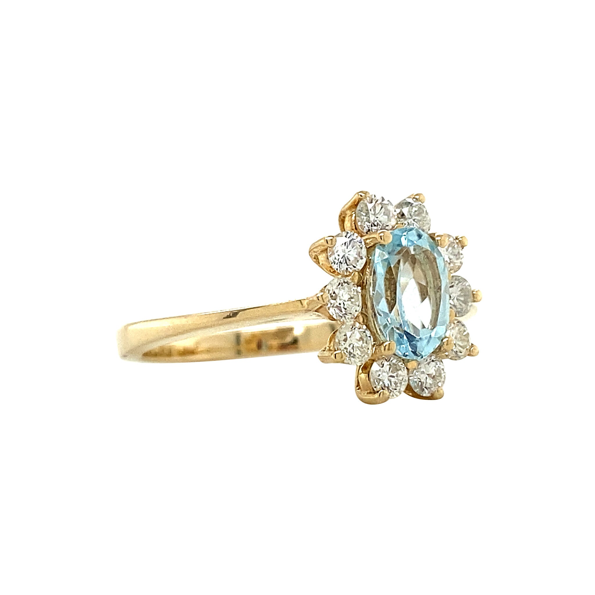 Gold entourage ring with topaz and diamonds 14 krt