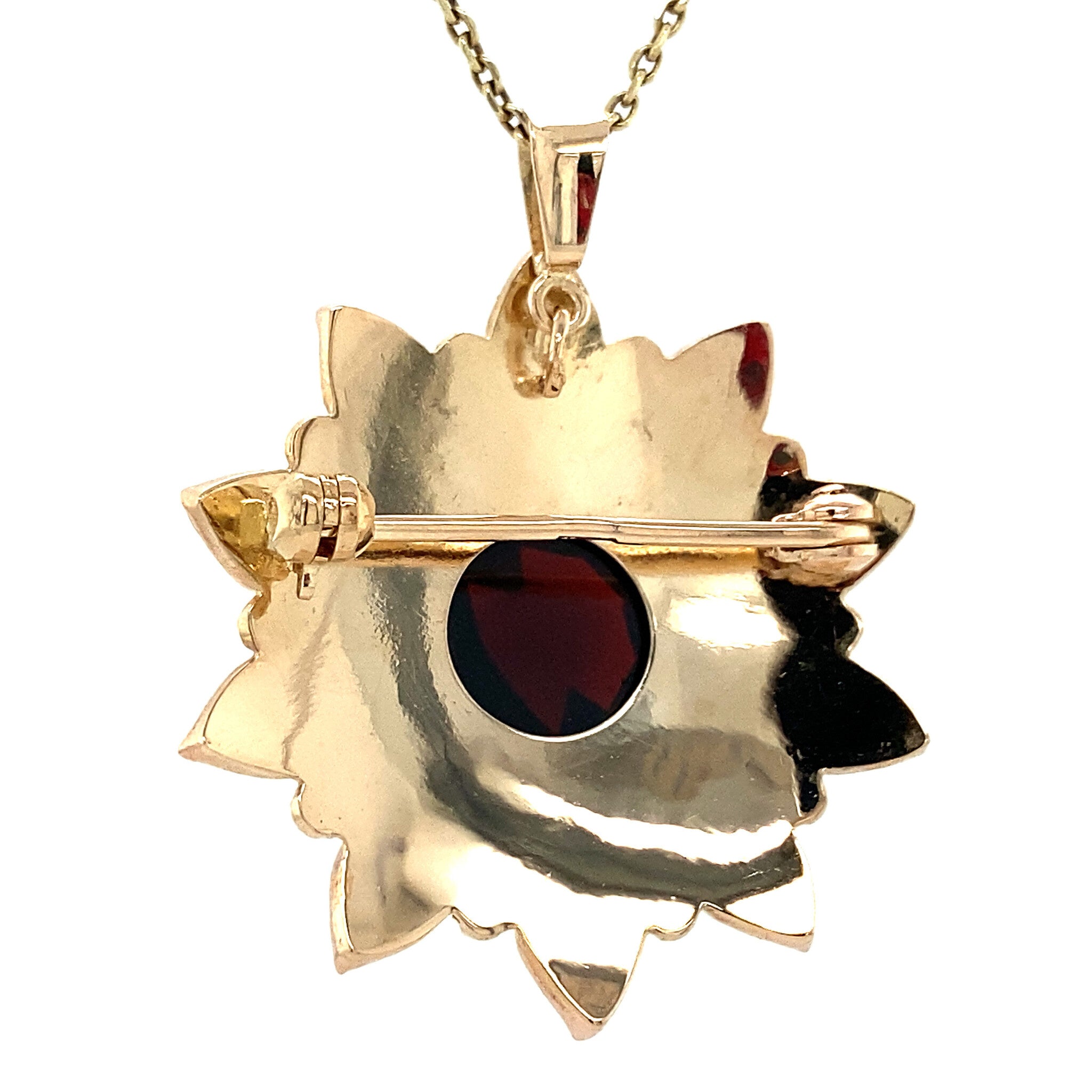 Gold entourage pendant with garnet 14 kt