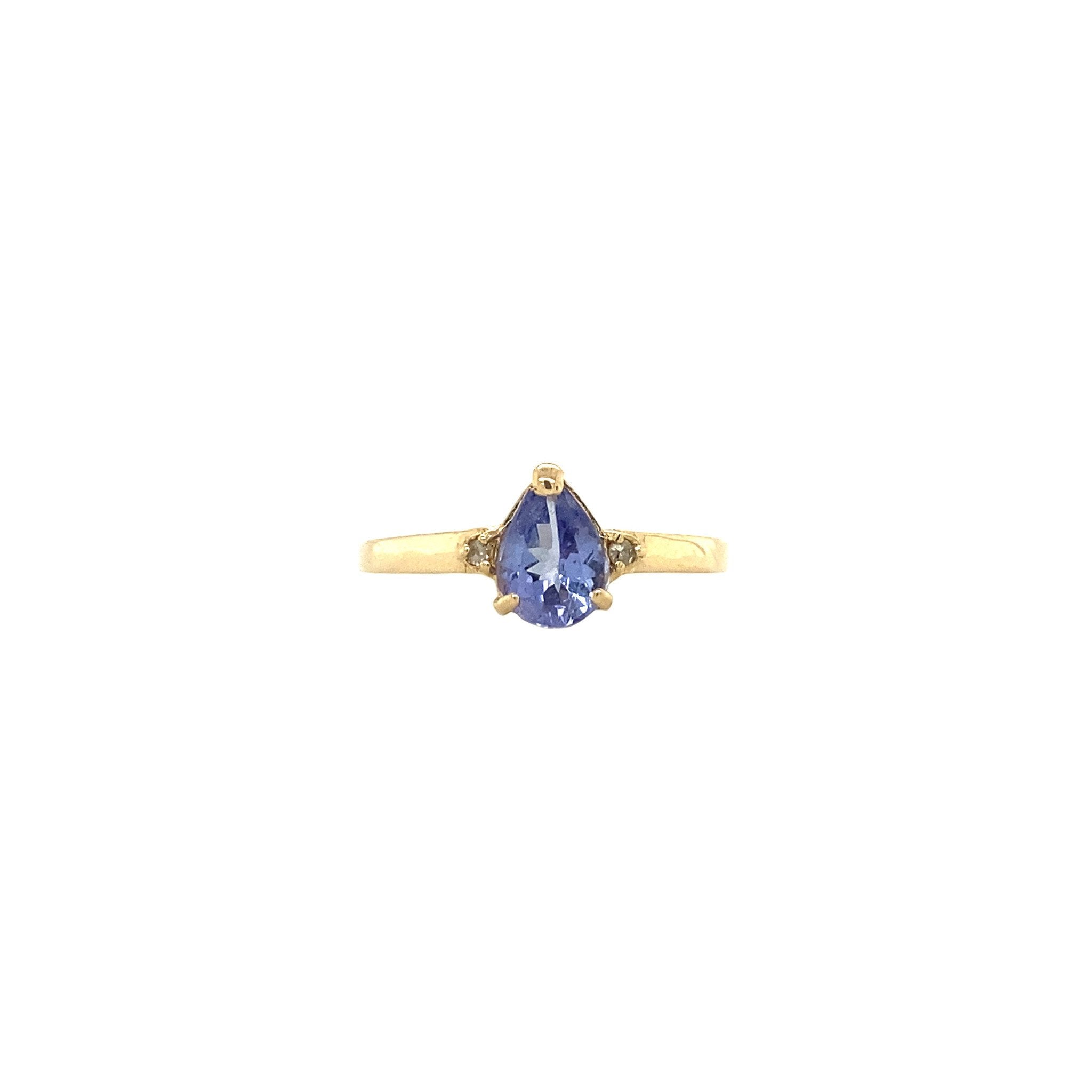 14 kt gold ring with a diamond and a colored gemstone