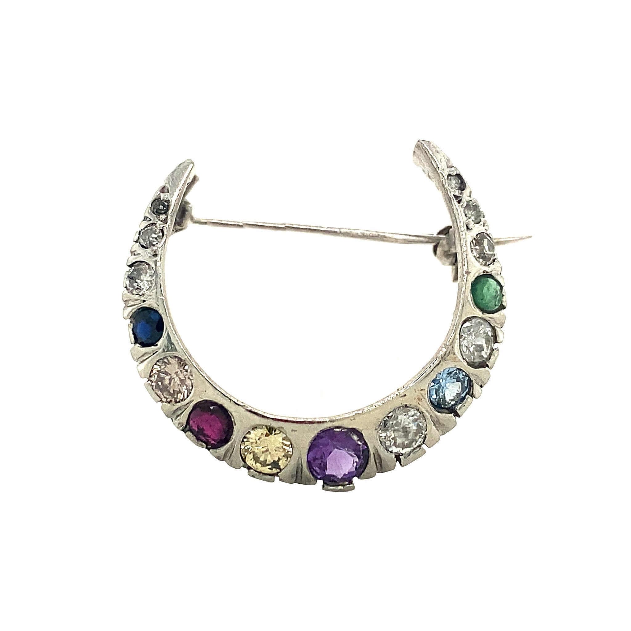 Witgouden broche crescent met diamant en glas 14 krt