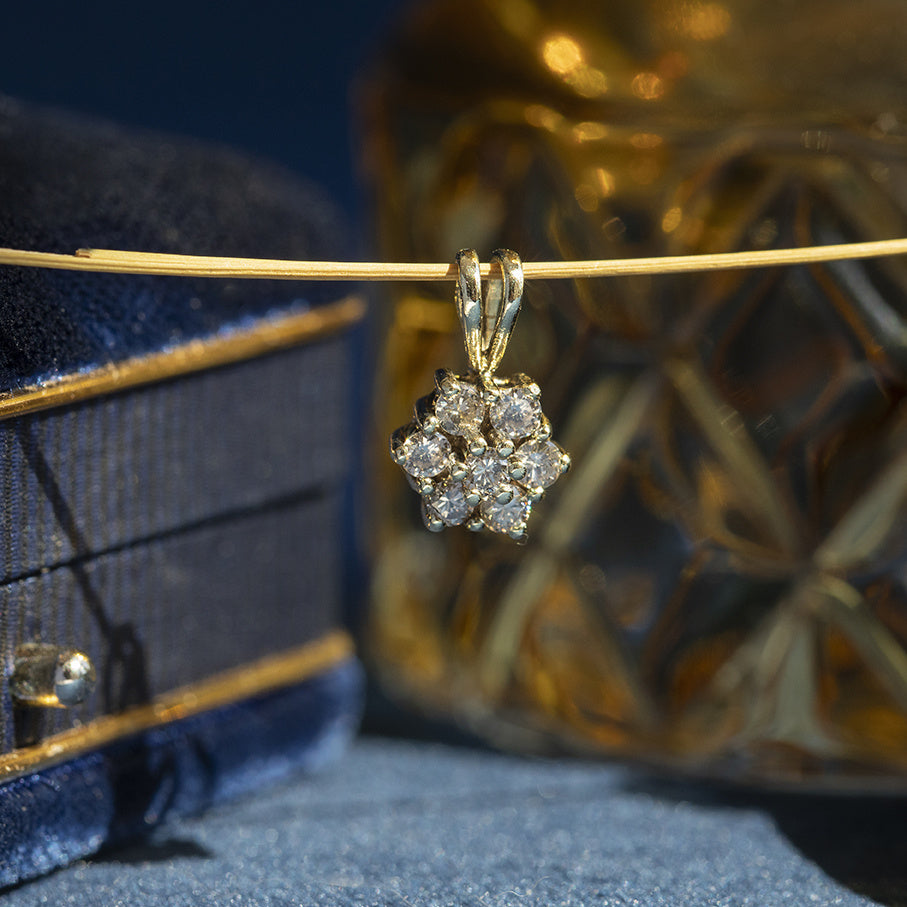 Vintage 14 kt gold halo pendant with diamond