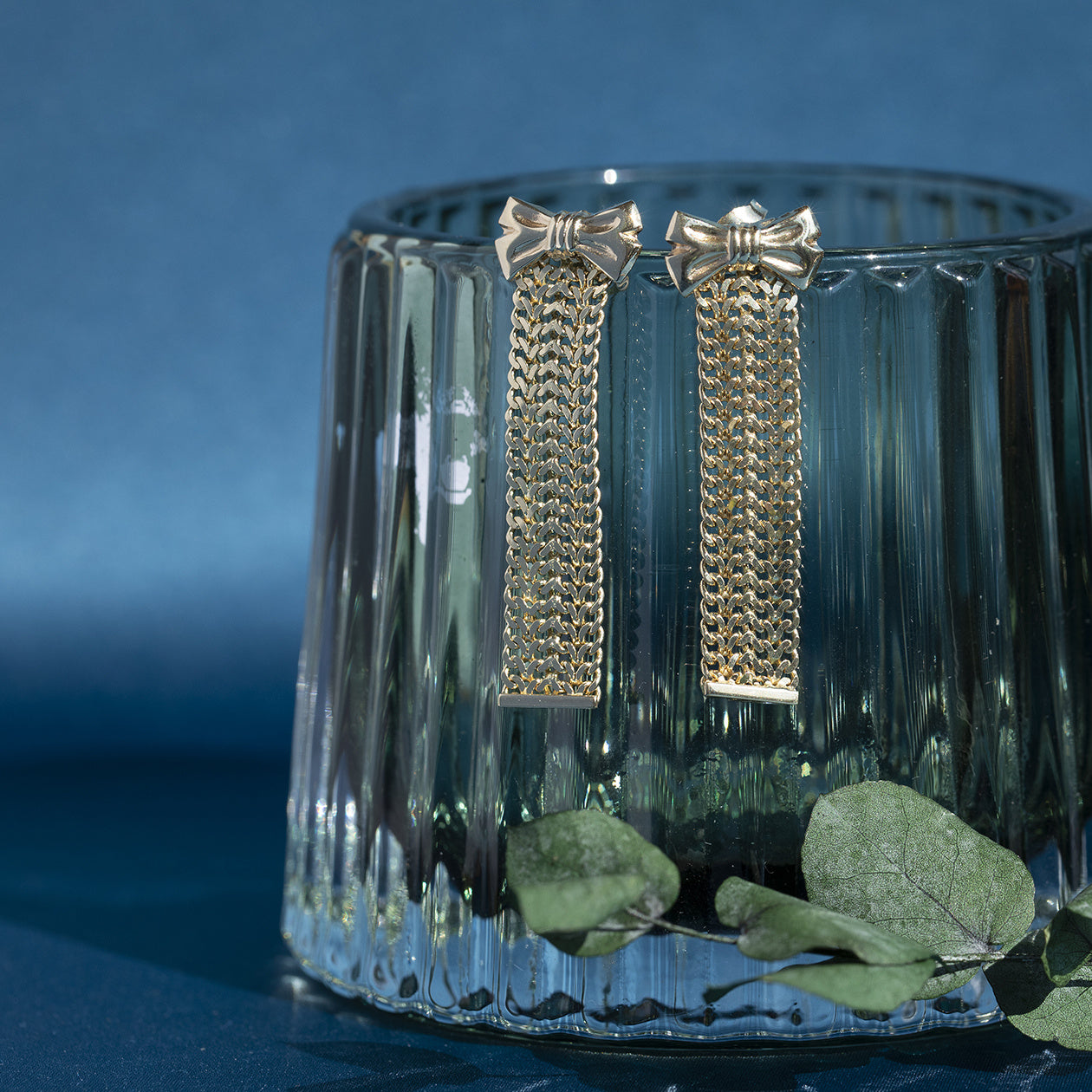 Gouden oorstekers met strik 14 krt