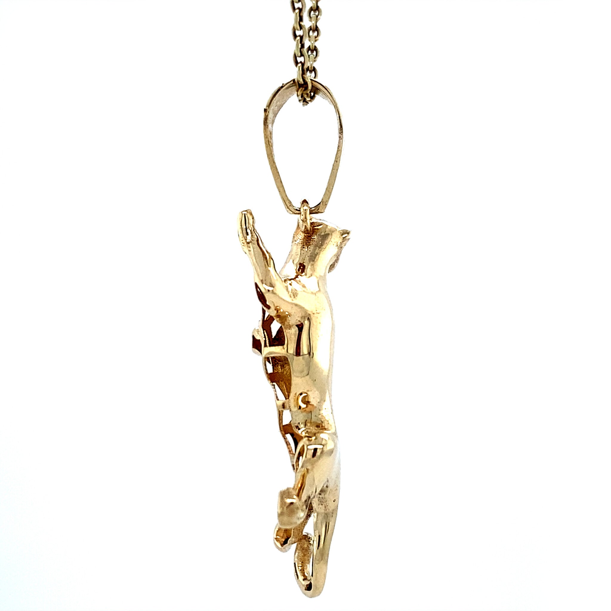 Vintage 14 kt gold panther pendant with colored stone