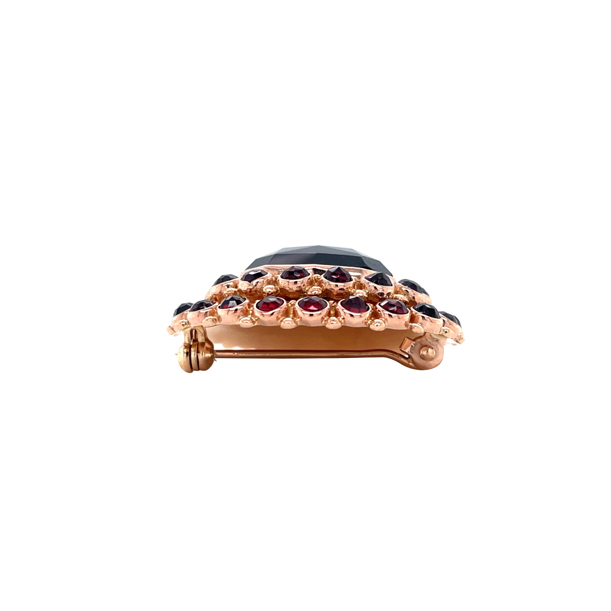 Vintage 14 kt gold entourage brooch with garnet