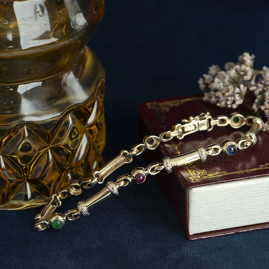 Gouden vintage armband met robijn, saffier, smaragd en diamant 14 kt