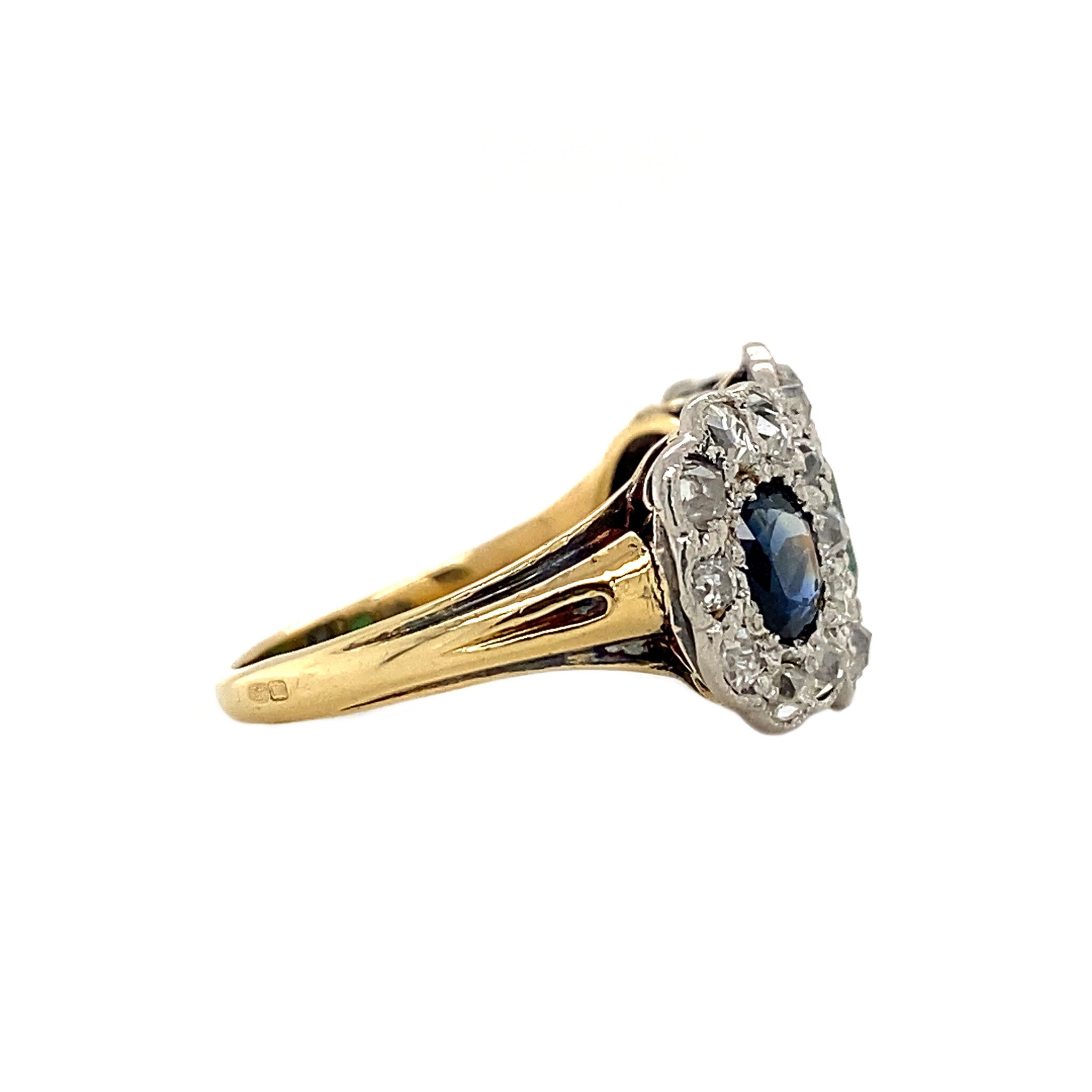 18 kt gold ring with emerald, sapphire and diamond