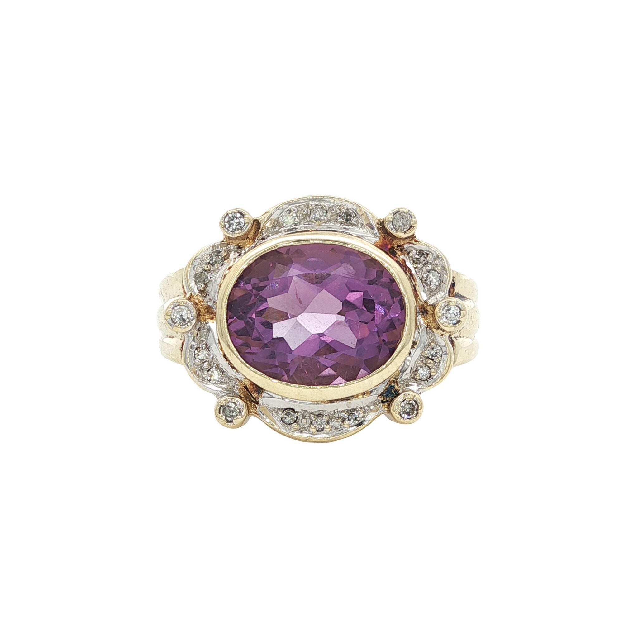 Vintage entourage ring met amethist en diamant 8 kt