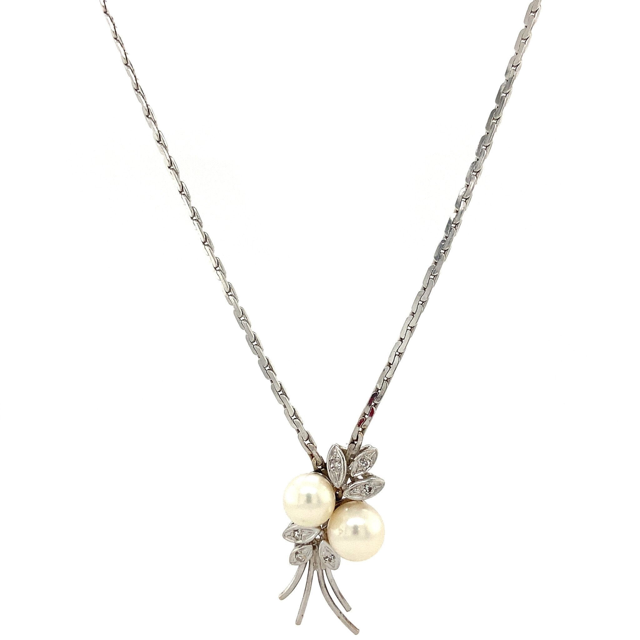 14 kt white gold necklace with diamond and pearl pendant