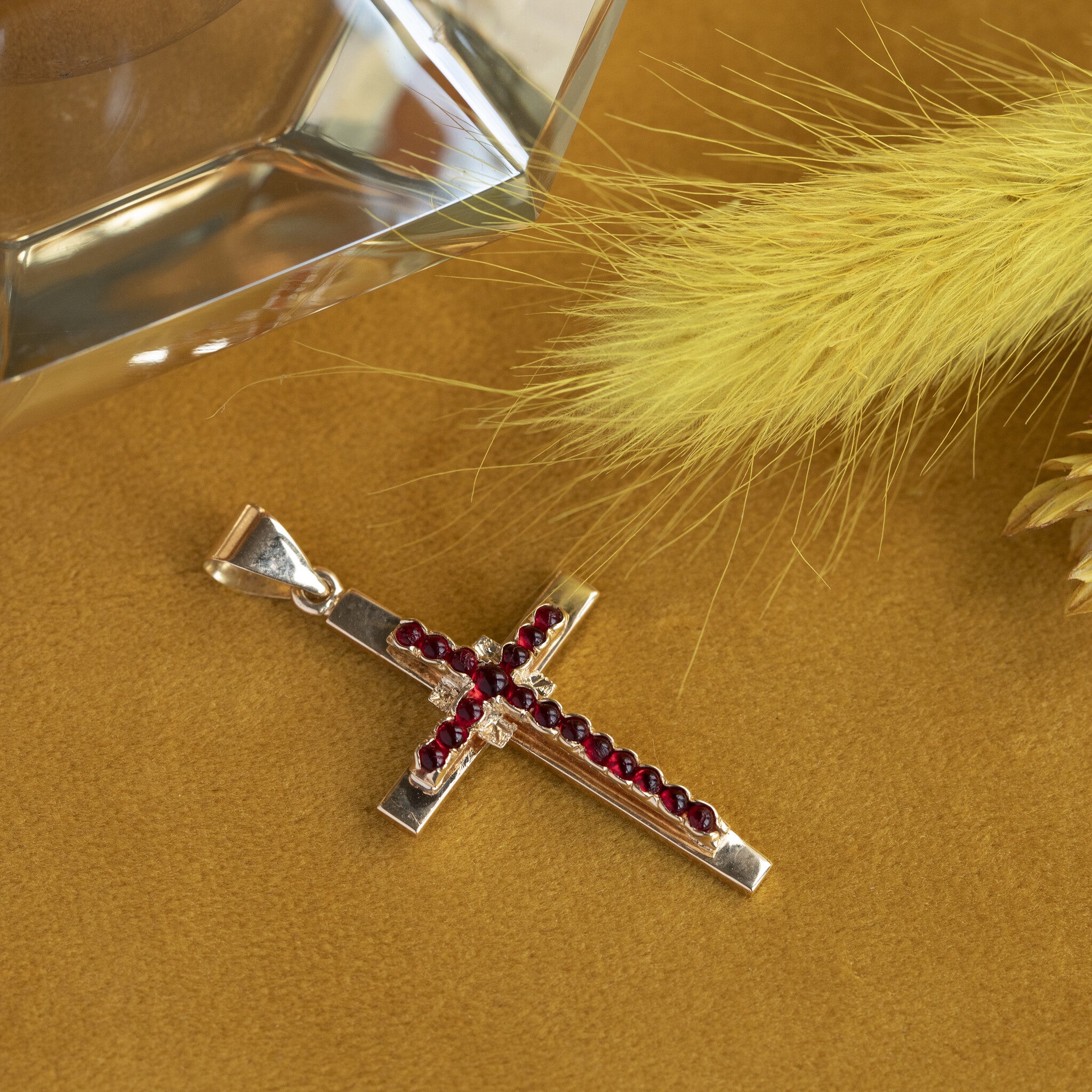 Gold cross pendant with glass garnet 14 krt