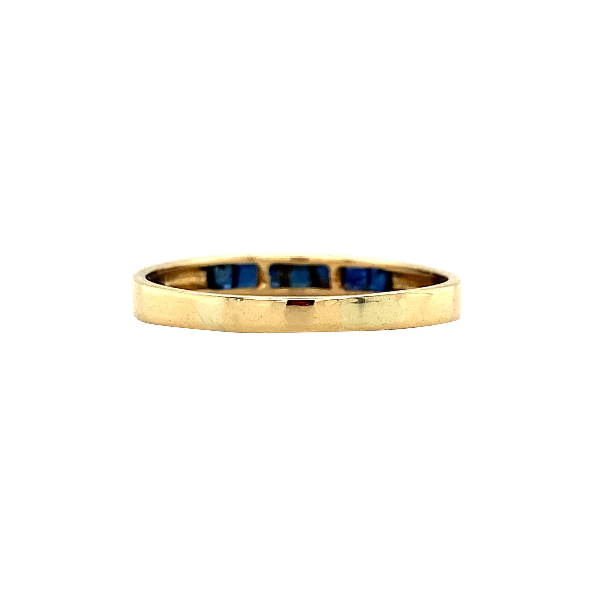 18 kt gold row ring with sapphire