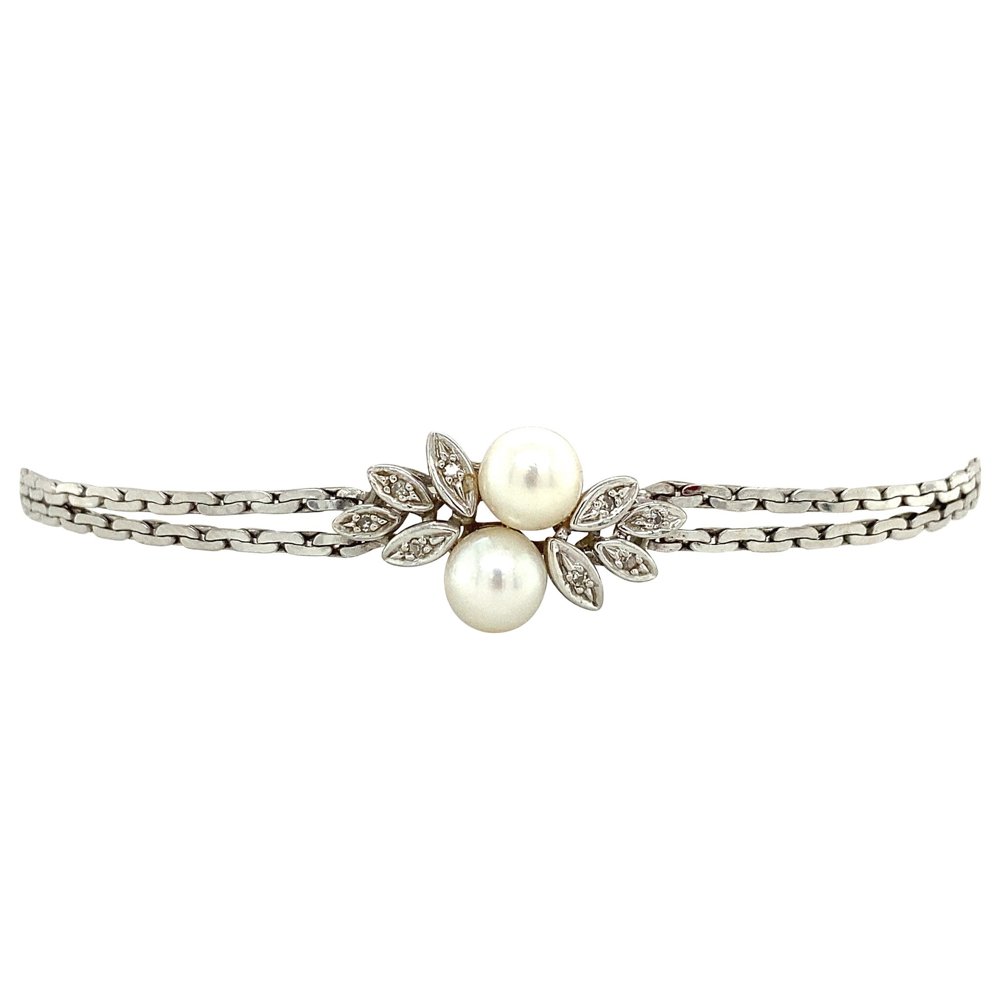 Vintage 14 kt white gold bracelet with diamond and pearl