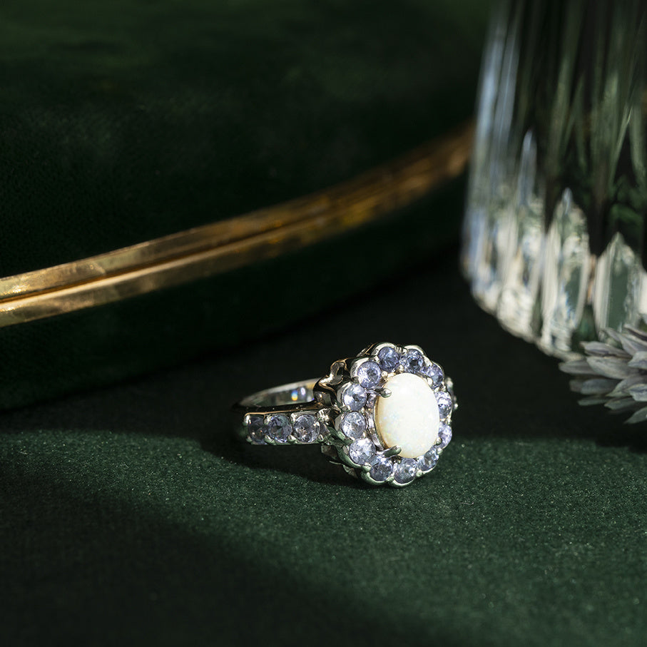 Vintage entourage ring with opal and tanzanite 10 kt