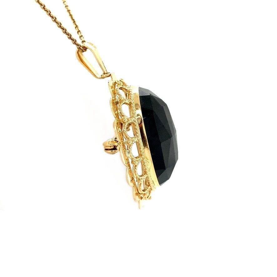 Gouden hanger / broche met granaat 14 krt