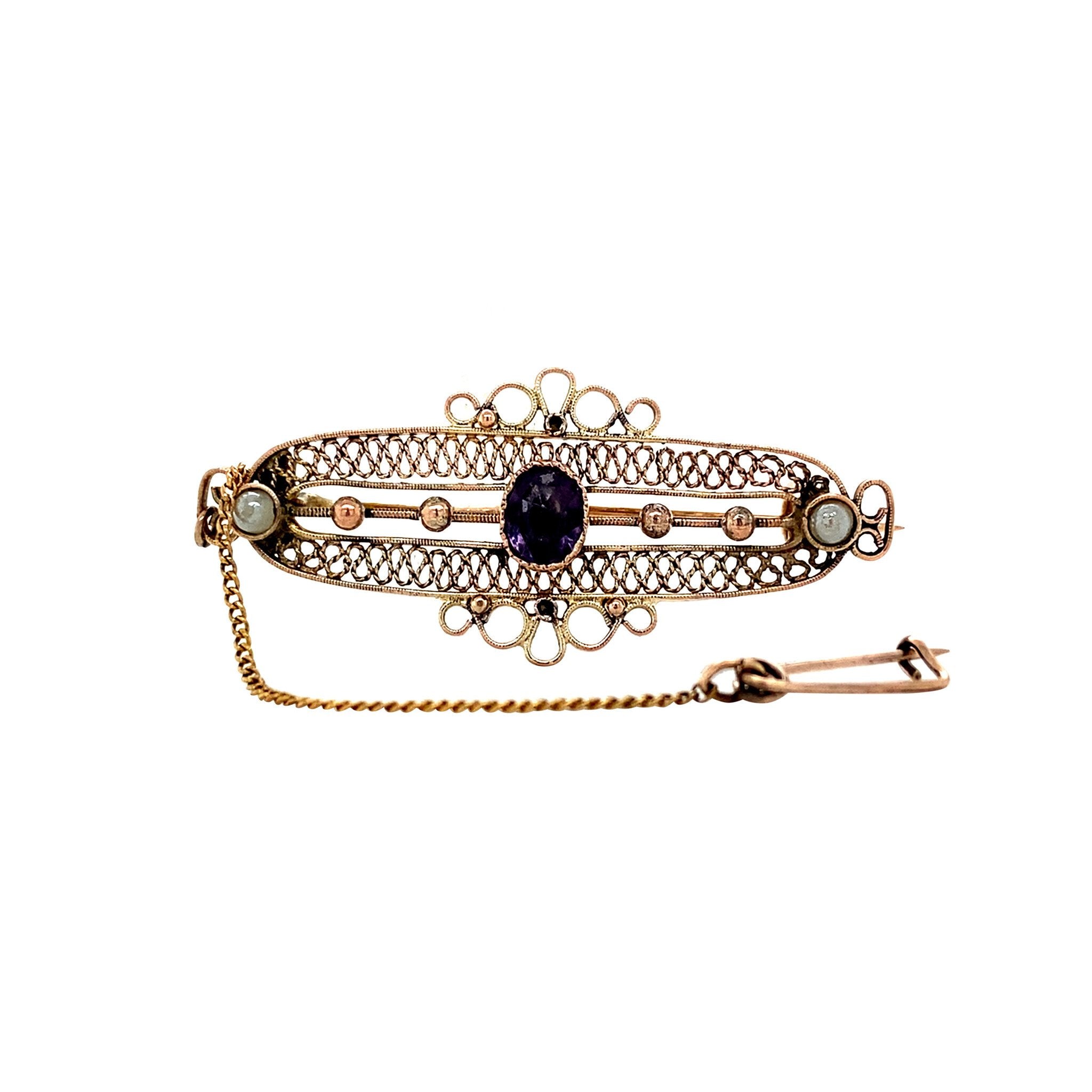 Gouden vintage broche met kleursteen en parel 14 krt