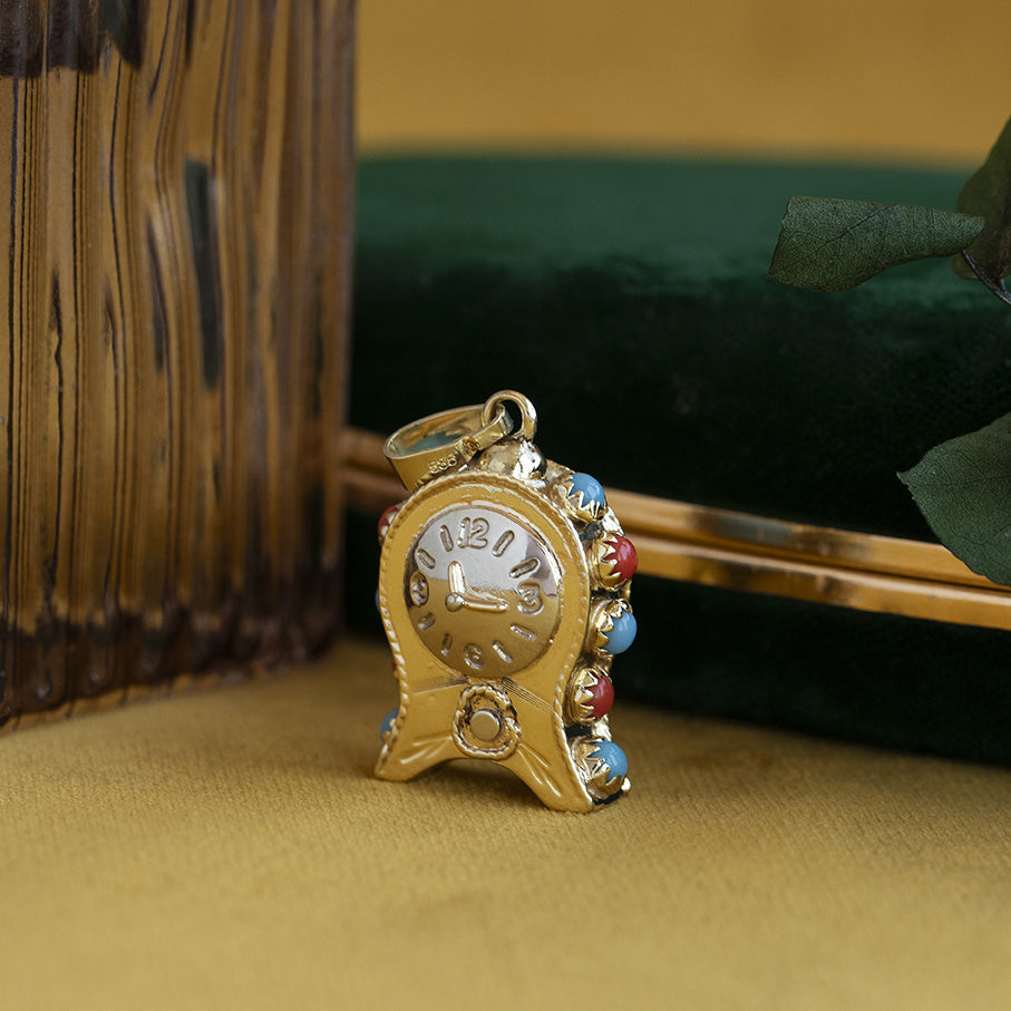 Gouden vintage klok hanger met kleursteen 14 krt