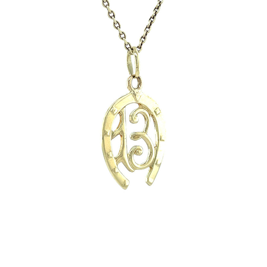 Golden vintage horseshoe number thirteen pendant 14 kt