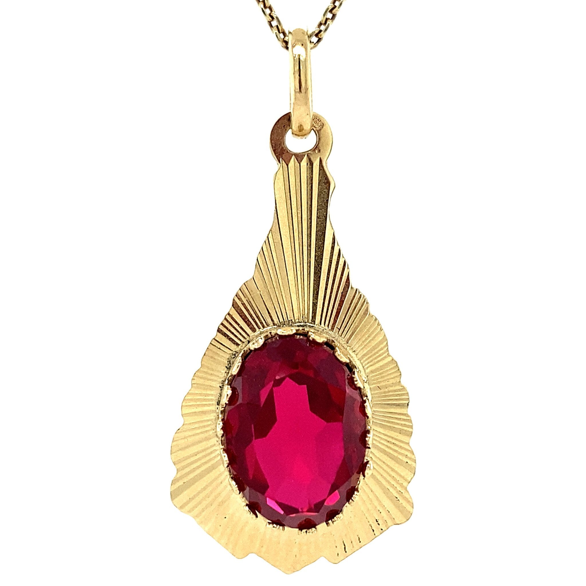 Gouden hanger met robijn 14 krt