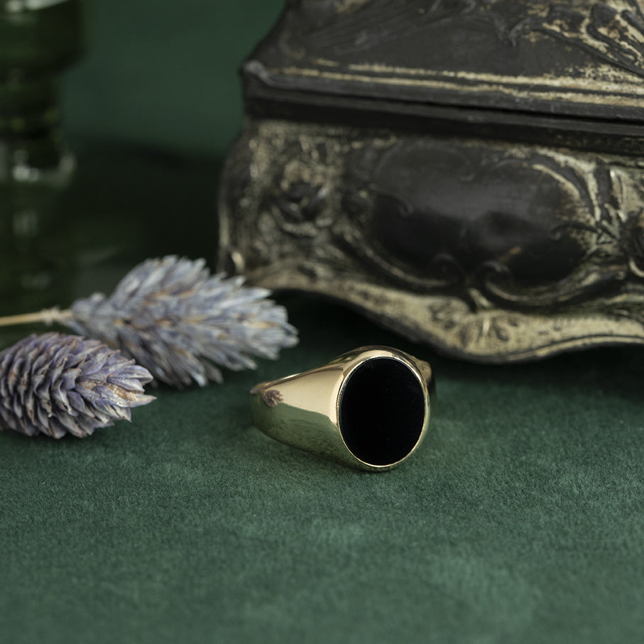 Gouden vintage zegelring met onyx 14 krt