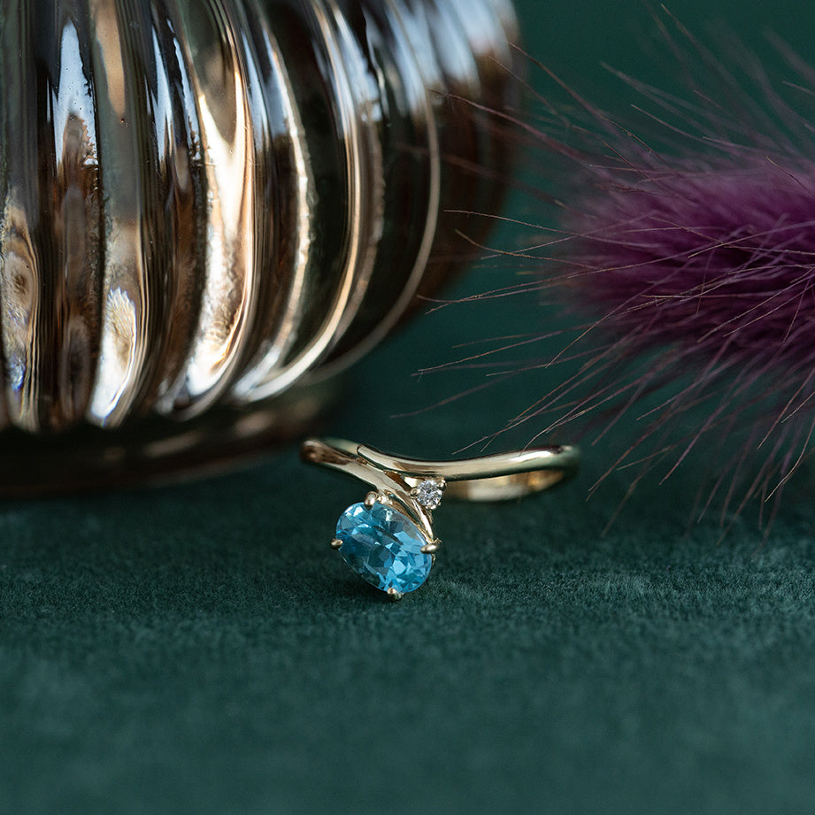 Gouden ring met topaas en diamant 18 krt