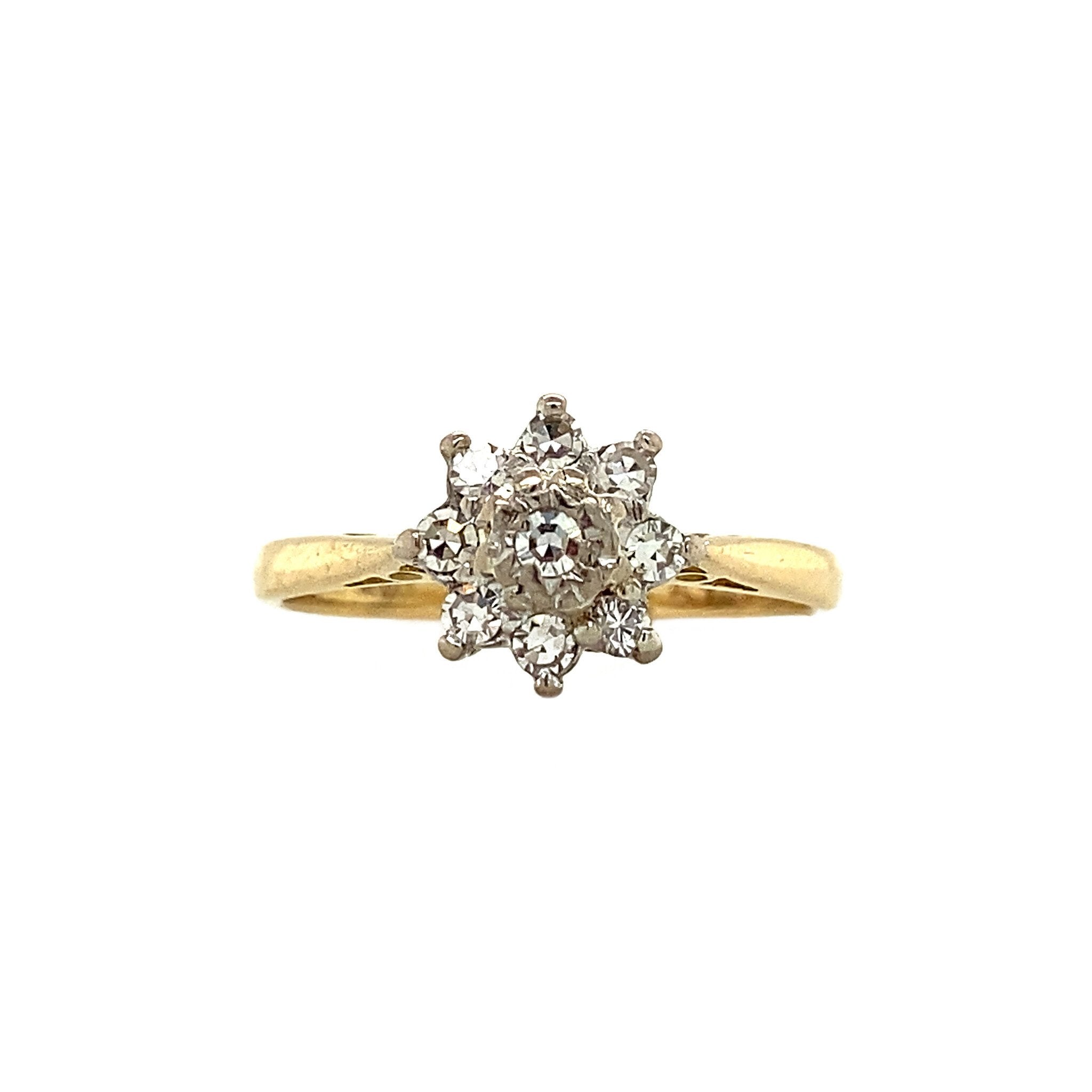18 kt gold halo ring with diamond
