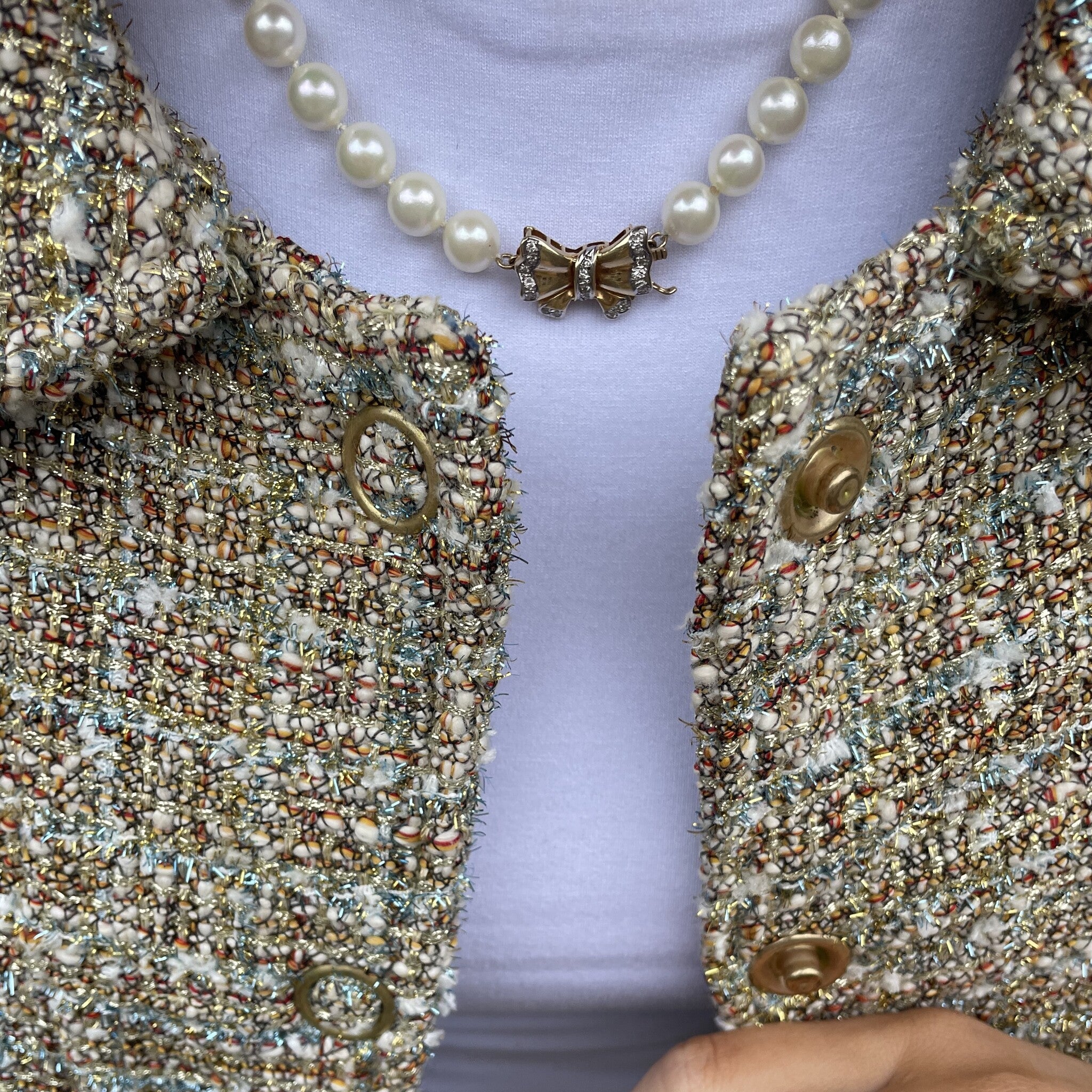 Parel collier met gouden strik sluiting 14 krt