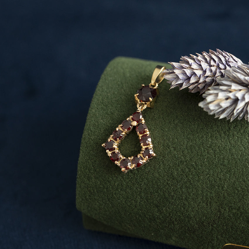 Gouden vintage hanger met granaat 18 krt