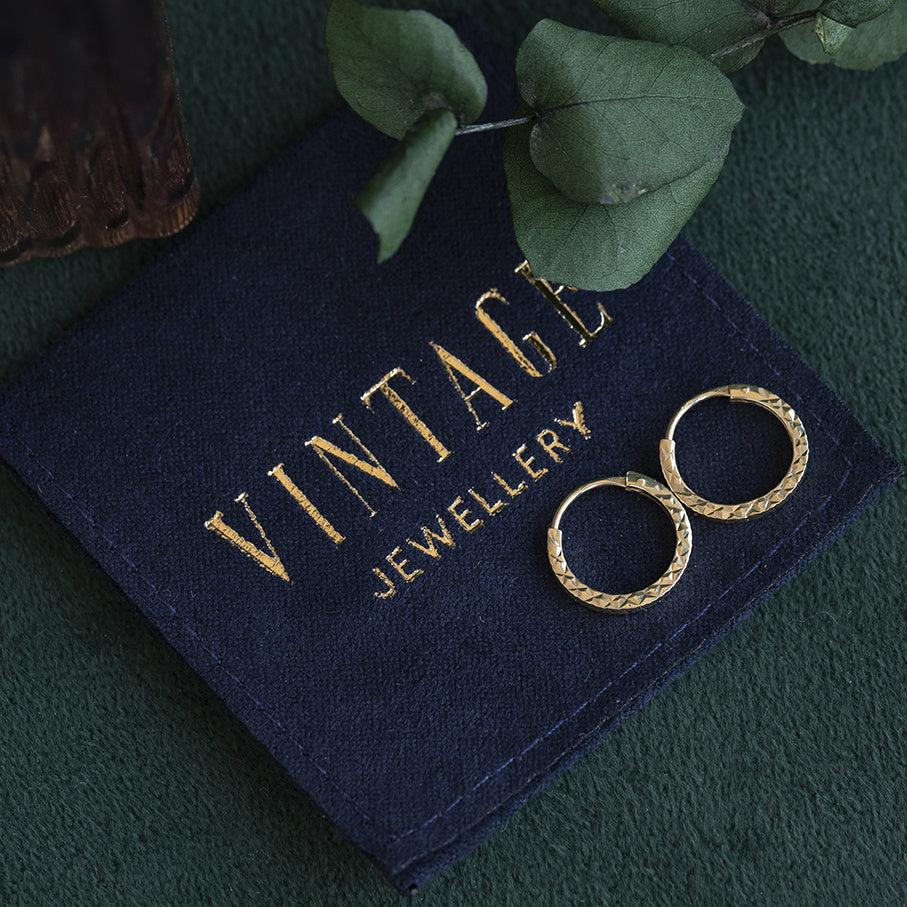 Gouden vintage fantasie oorringen 14 kt