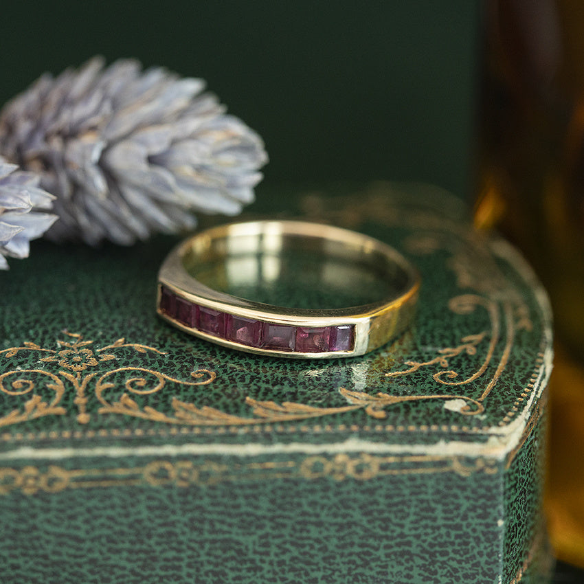 Golden vintage row ring with ruby 14 kt