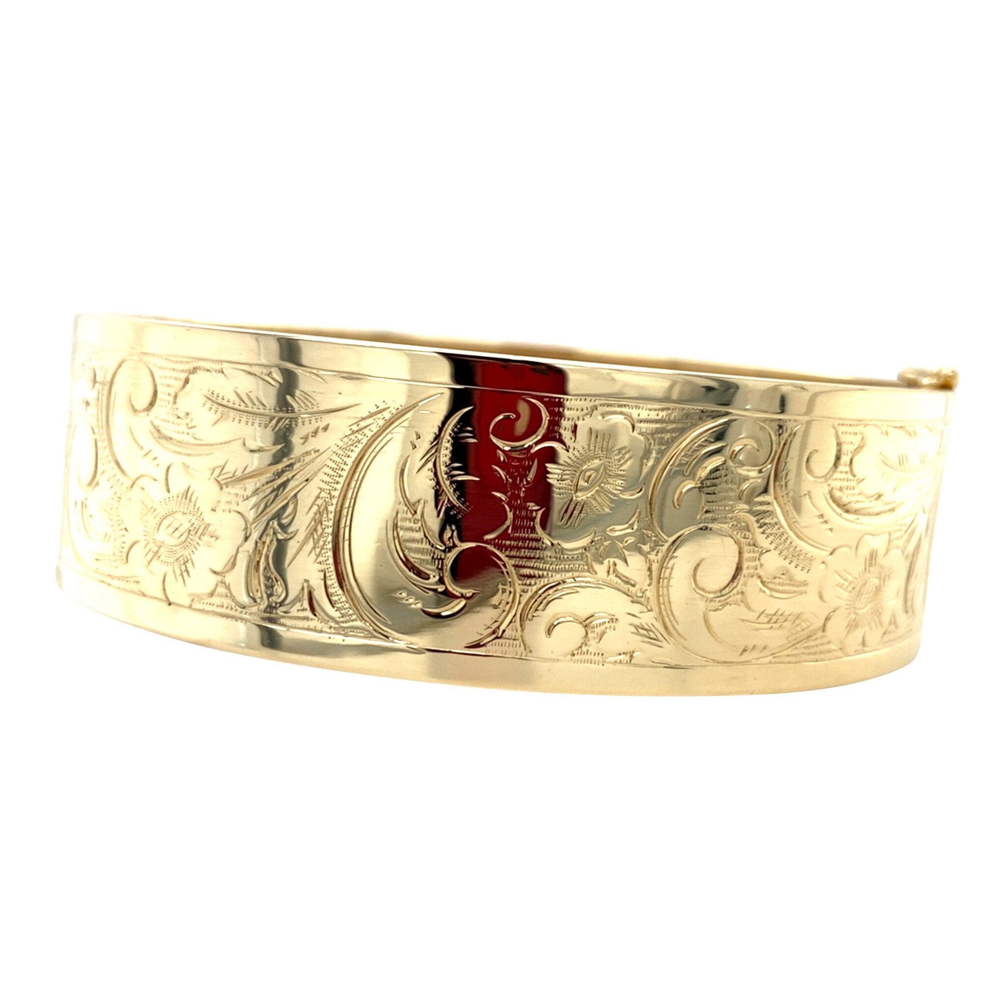 Gouden vintage bangle met gravure 14 krt