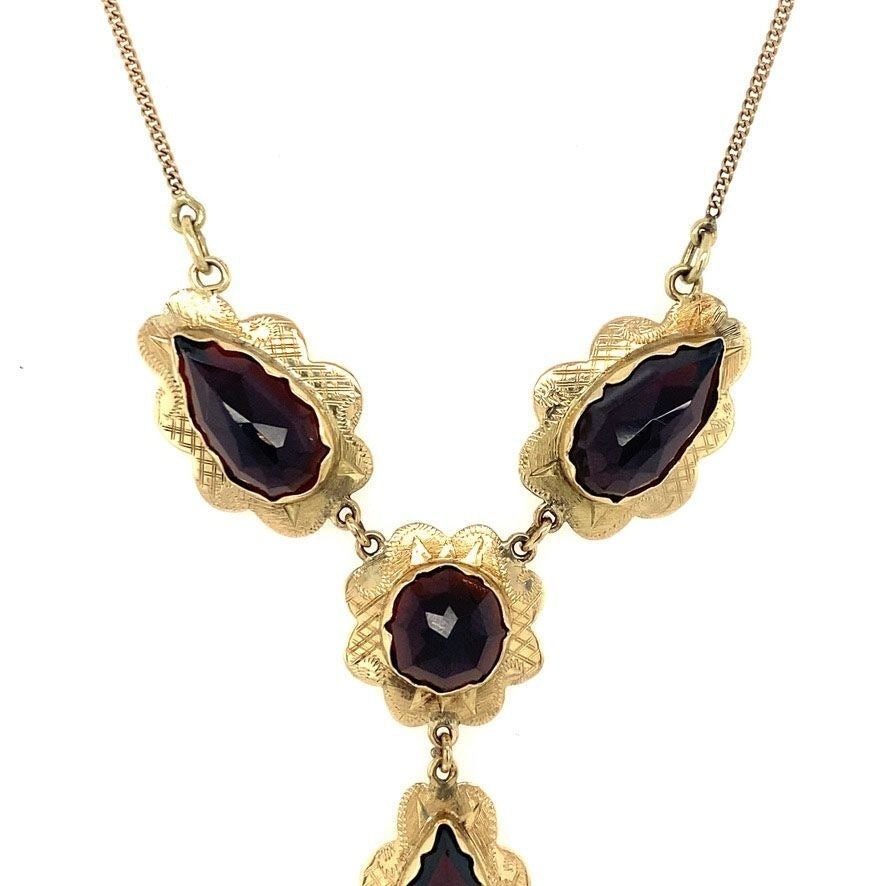 Gouden collier met granaat 14 krt