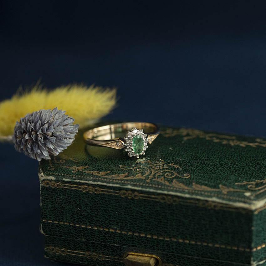 Entourage ring with emerald and diamond 9 carat