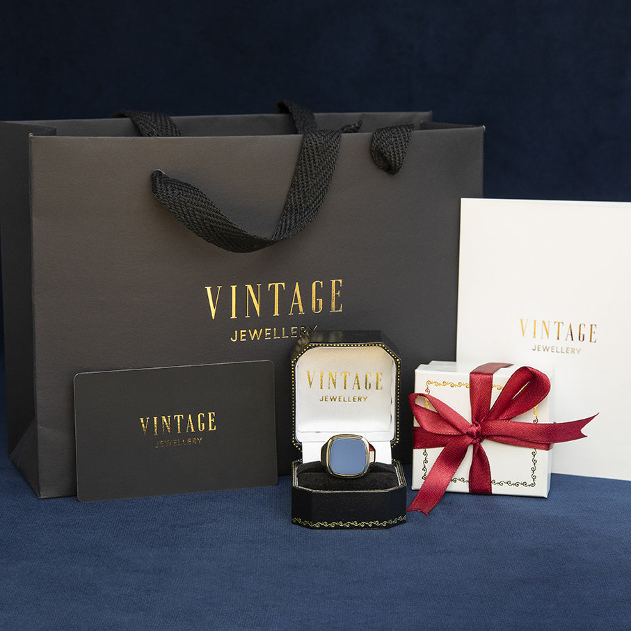 Gouden vintage zegelring met blauwe laagsteen 14 kt