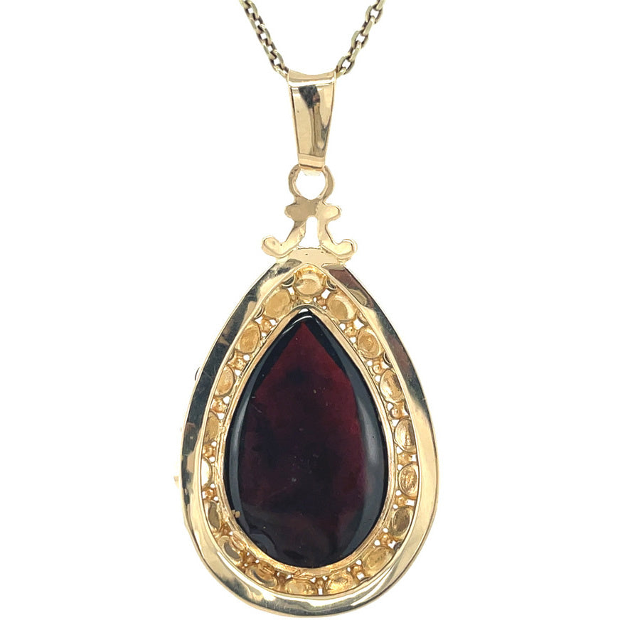 Gouden vintage entourage hanger met granaat 14 kt