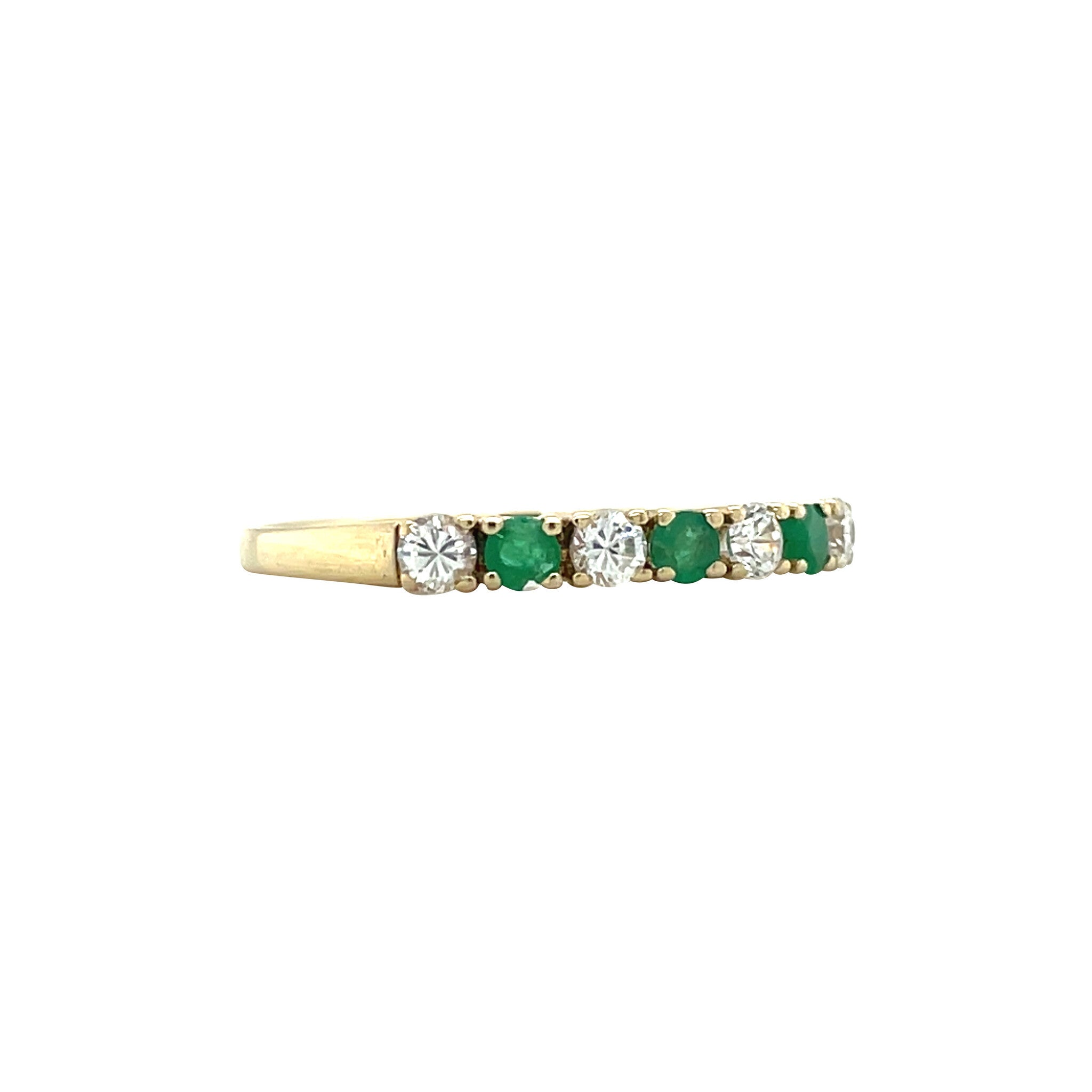 14 kt gold row ring with emerald and zirconia