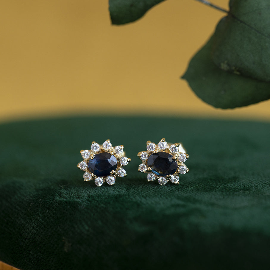 Vintage gold entourage stud earrings with sapphire and zirconia, 14 kt