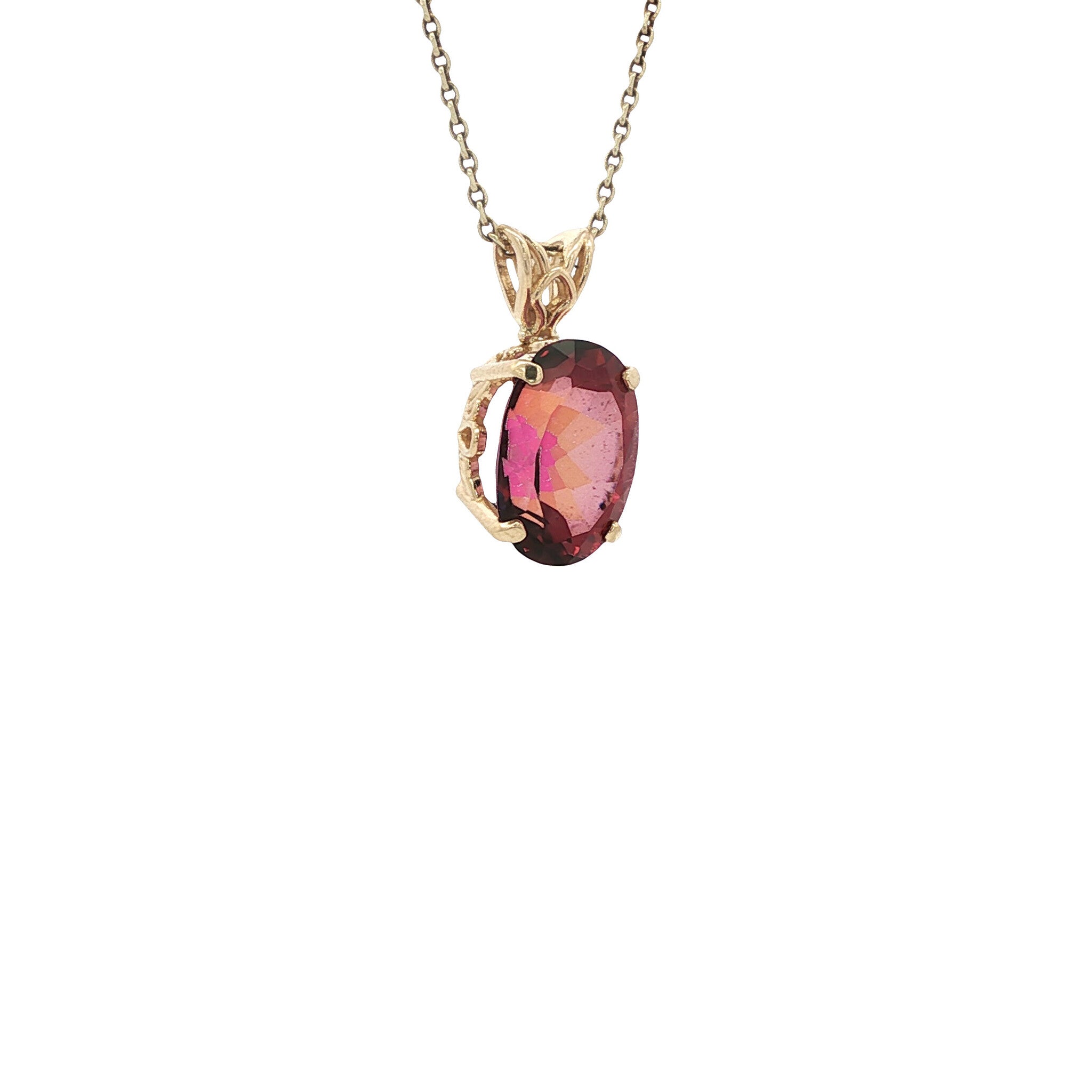 Gold pendant with a mystical topaz 14 kt