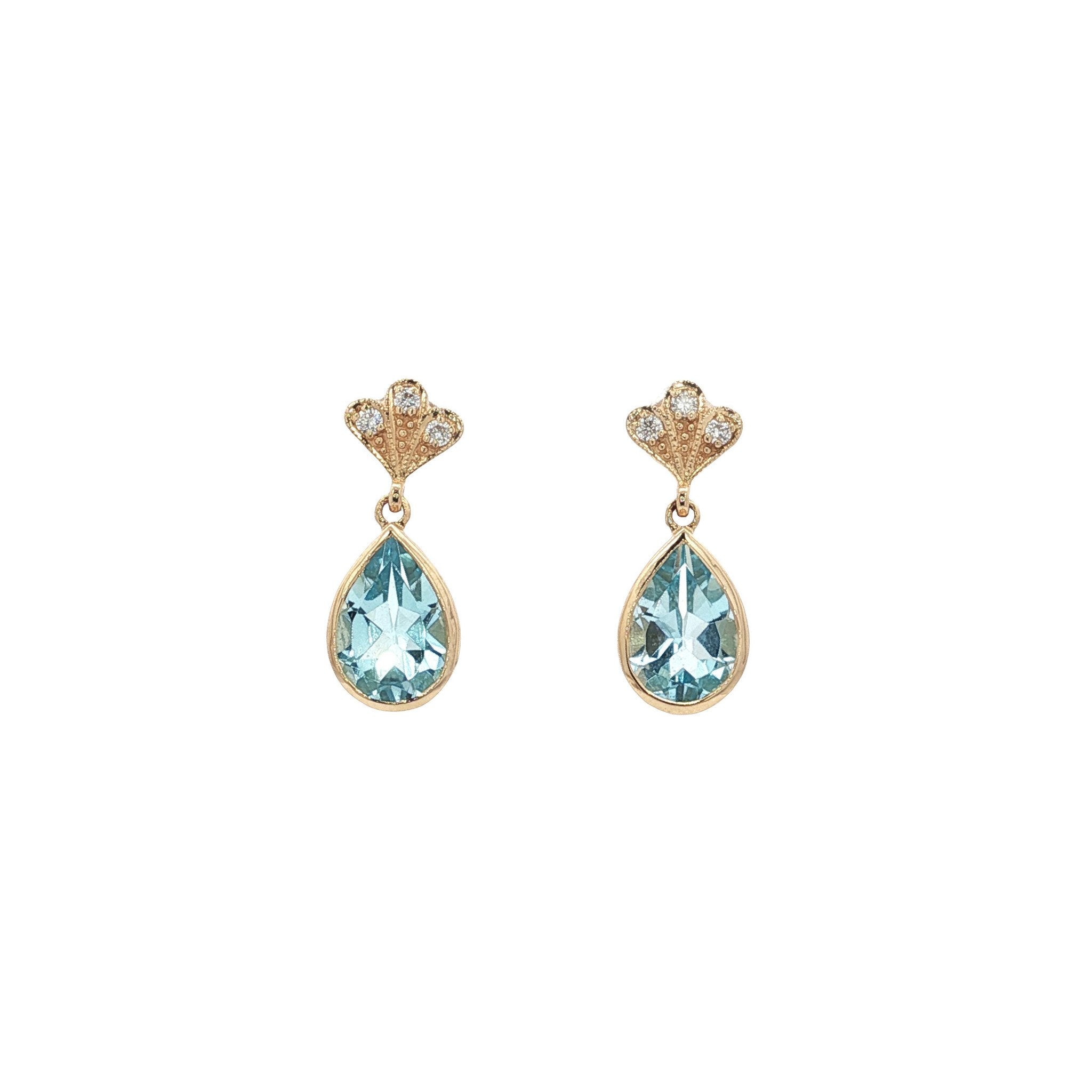 Gouden oorbellen met topaas en diamant 14 kt